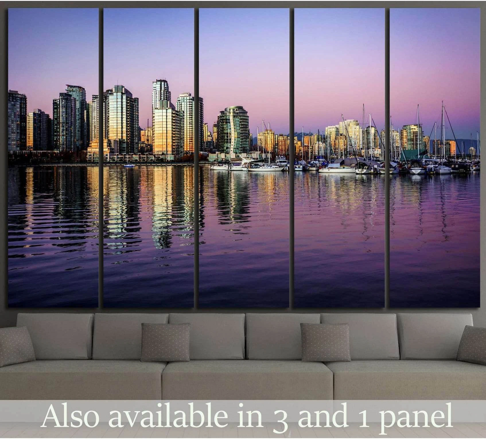 City skyline marina canvas print with purple sunset reflections above a sofa in a modern living room