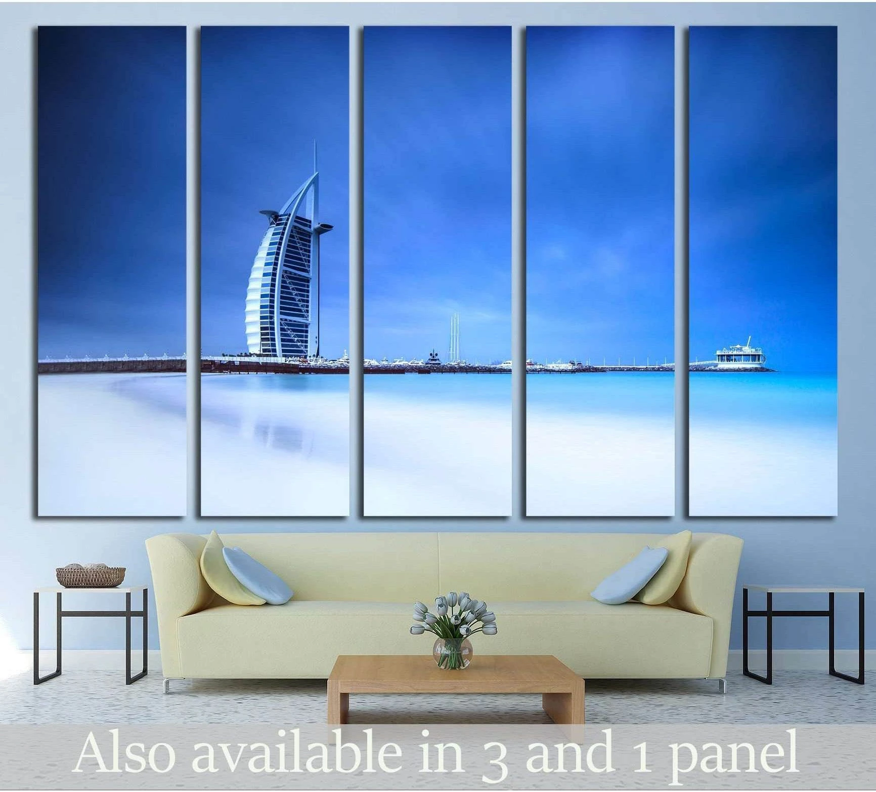 Burj Al Arab hotel on Jumeirah beach in Dubai, modern architecture, luxury beach resort, summer vacation and tourism concept showing sea water, shoreline and horizon depth.