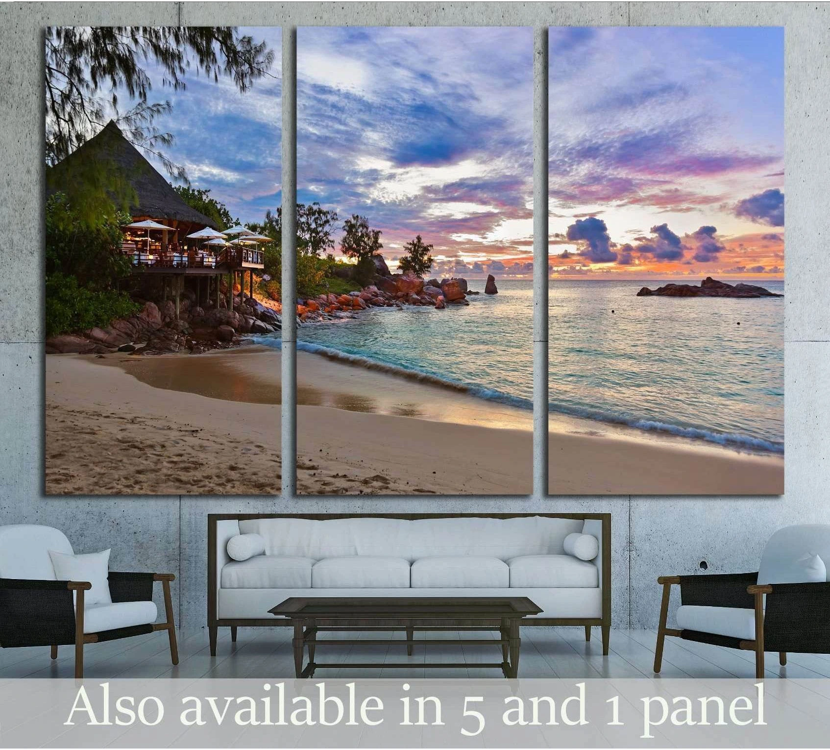 Cafe on Seychelles tropical beach at sunset - nature backgroun showing sea water, shoreline and horizon depth.