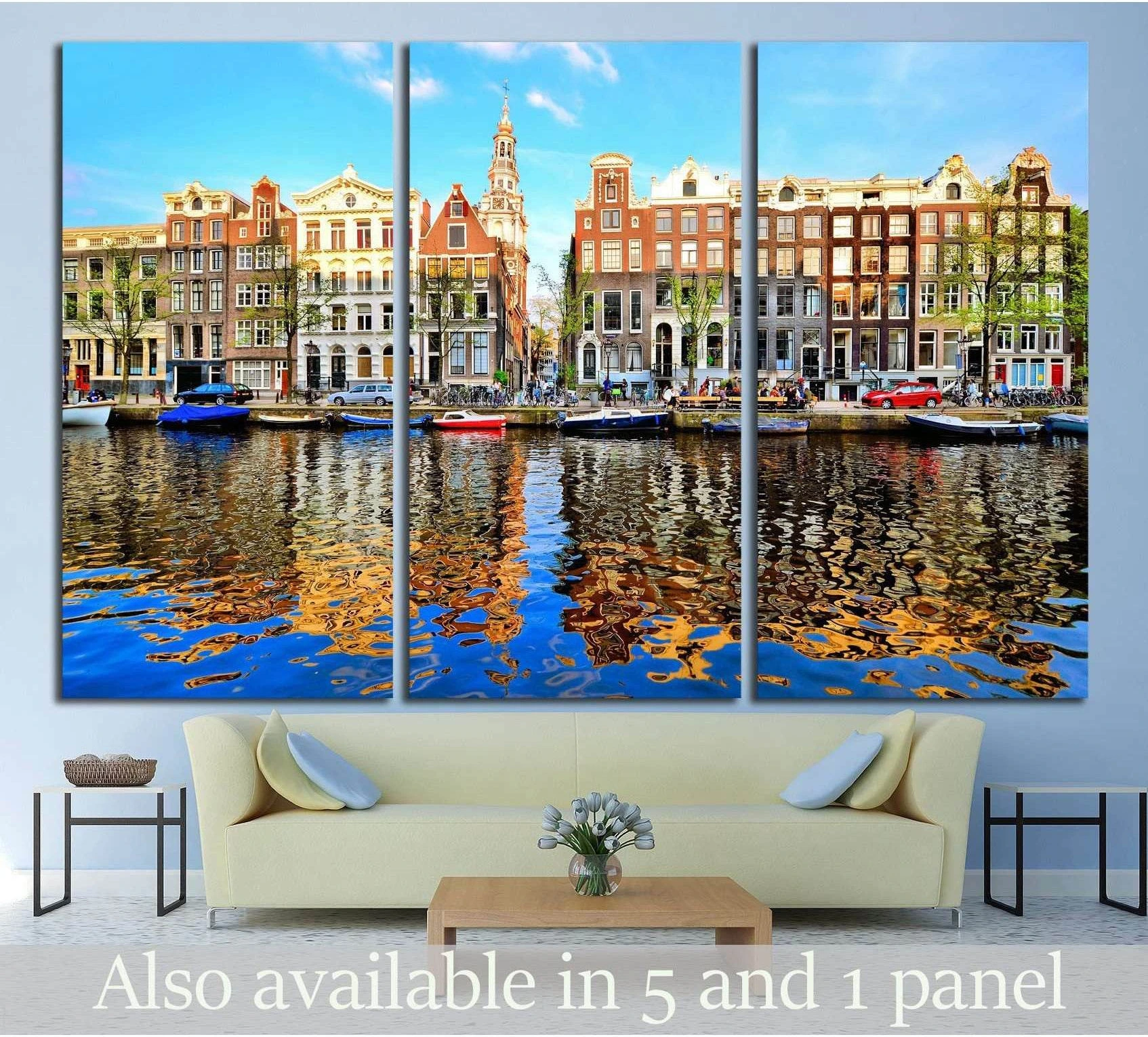 Amsterdam canal houses triptych canvas print with dusk reflections above a sofa in a modern living room