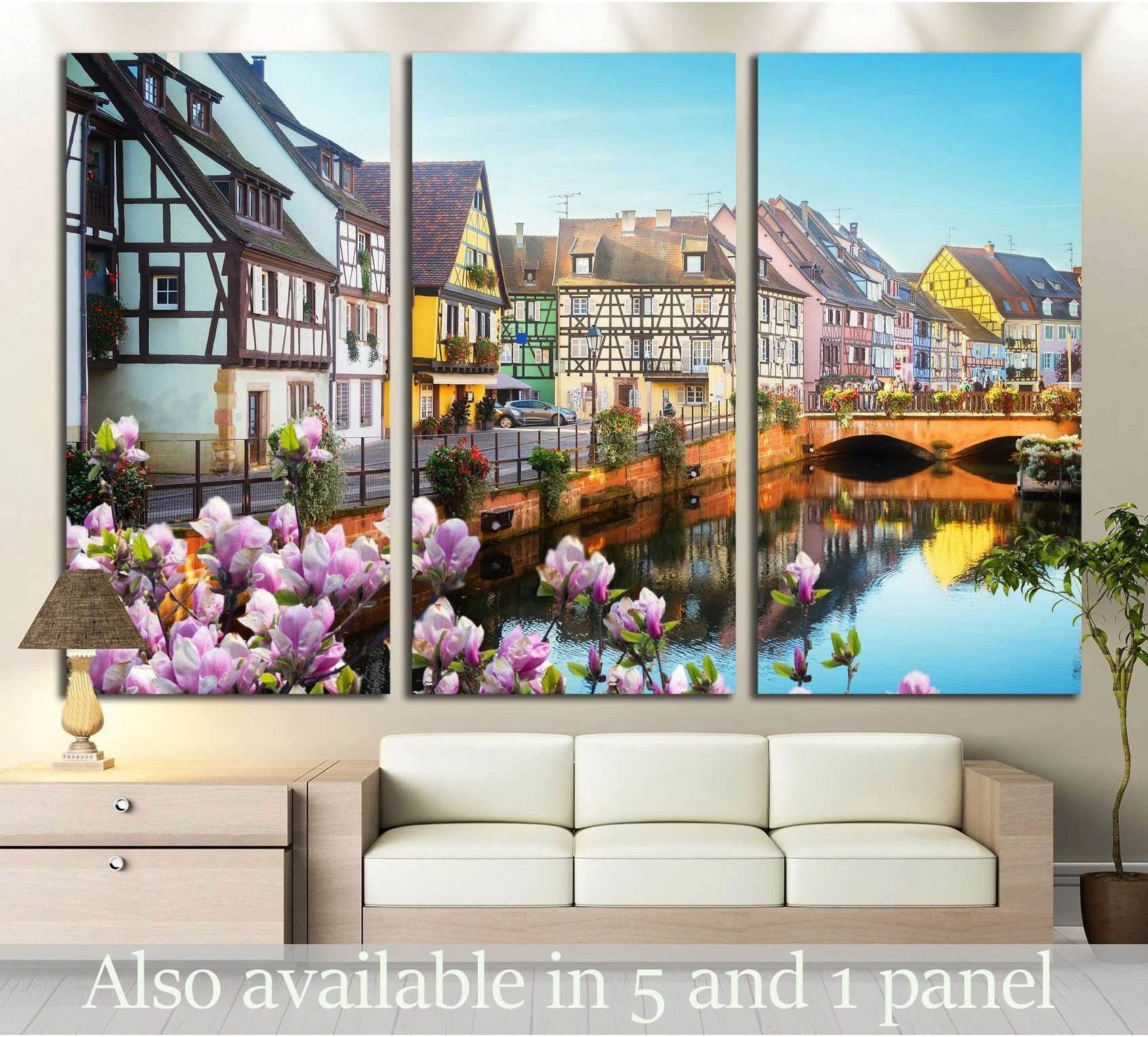 Colmar canal triptych canvas print with Alsace houses and pink spring flowers above a sofa