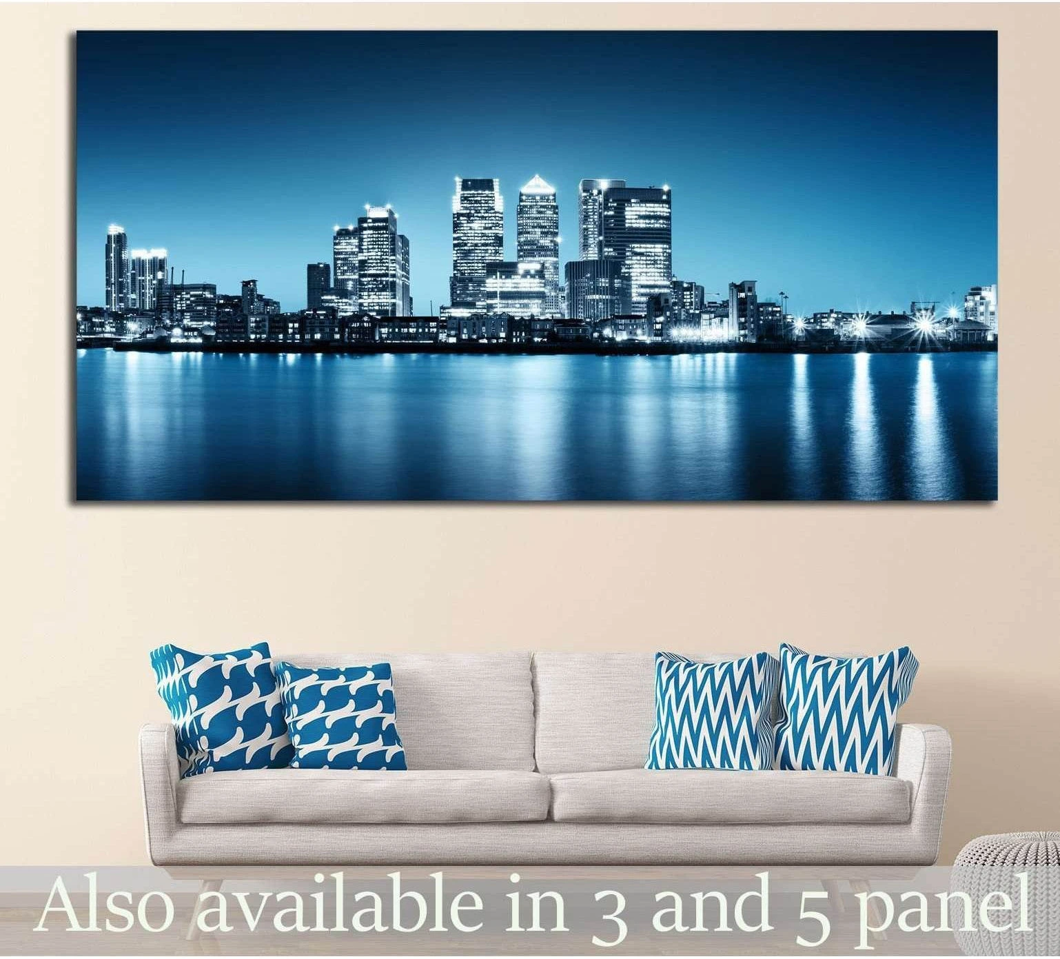 Canary Wharf London skyline canvas print in blue night tones above a sofa in a modern living room