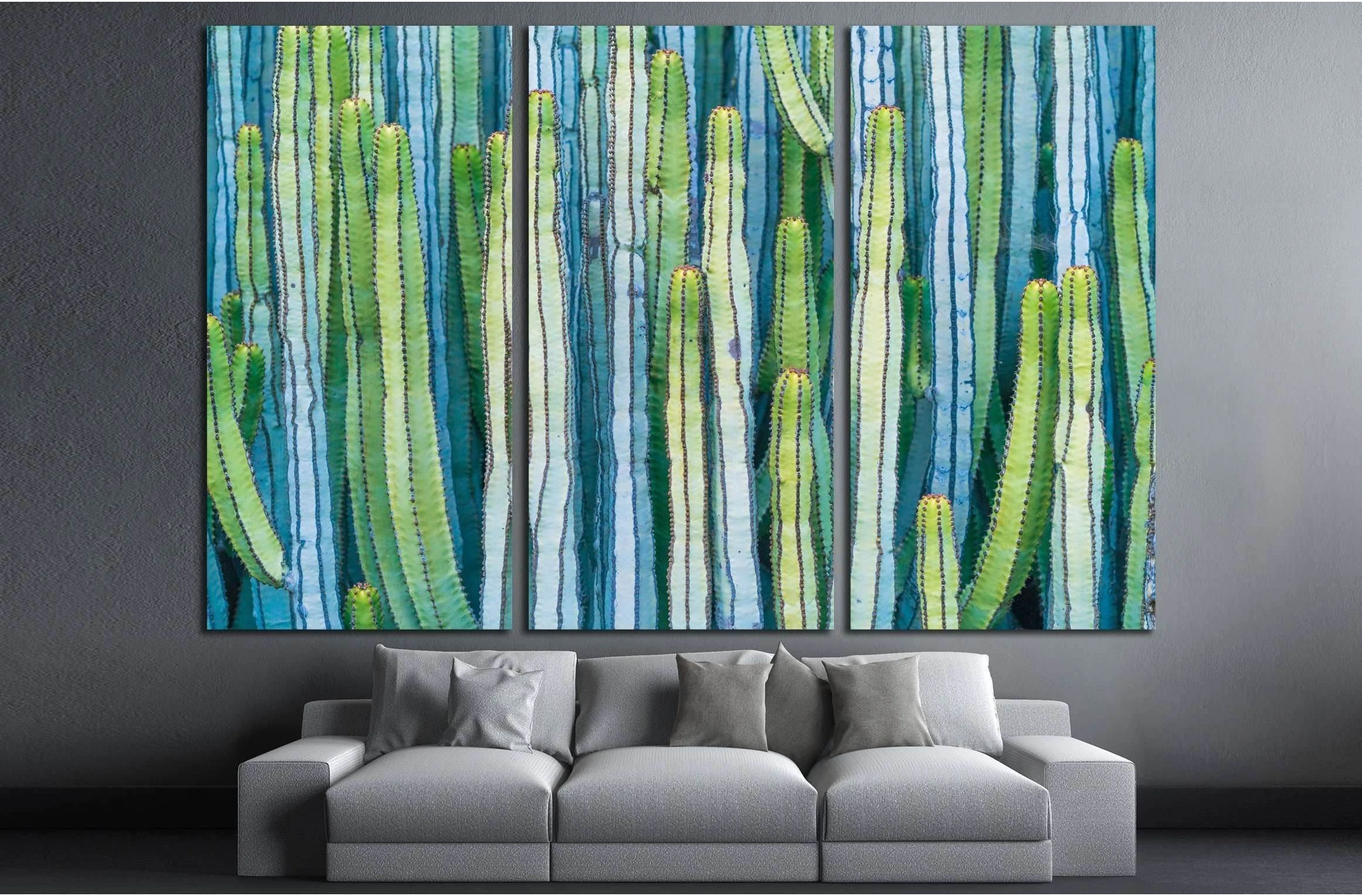 A wall-hanging piece of art featuring a composition of vertical, long, and thin, green, blue, and white cactus-like plants., product view 3