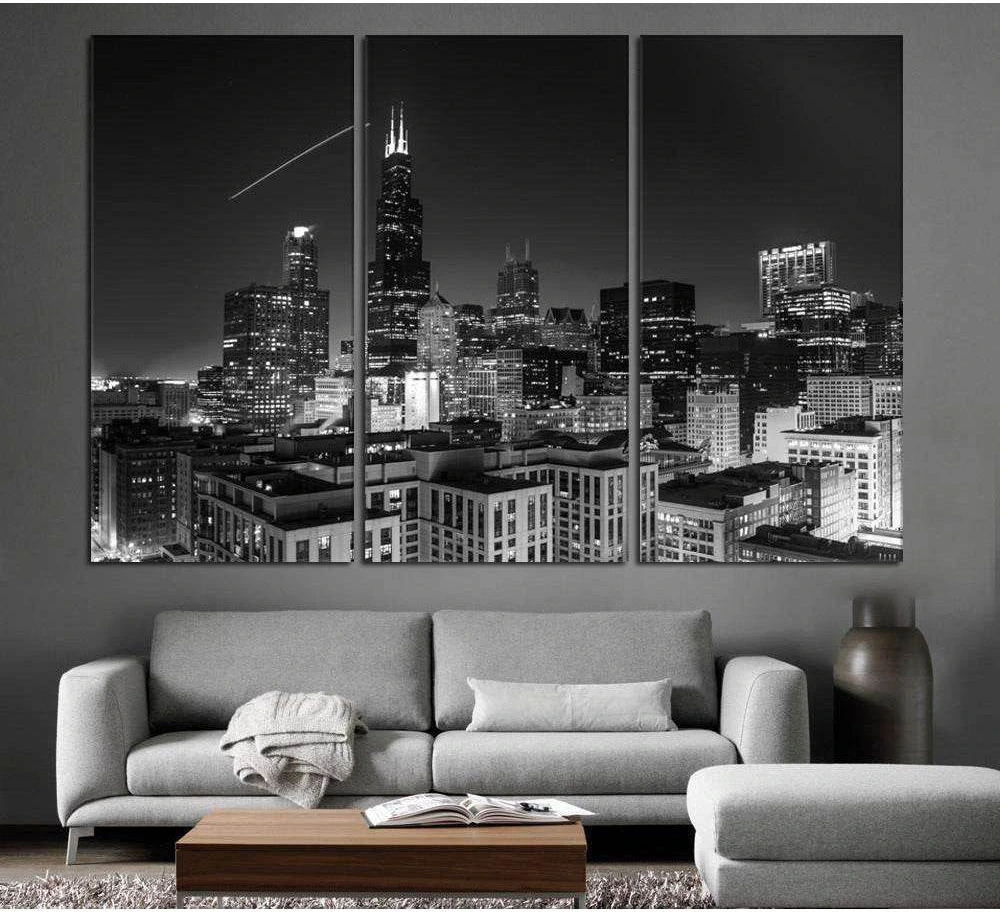 Black and white Chicago skyline canvas print triptych above sofa in a modern living room