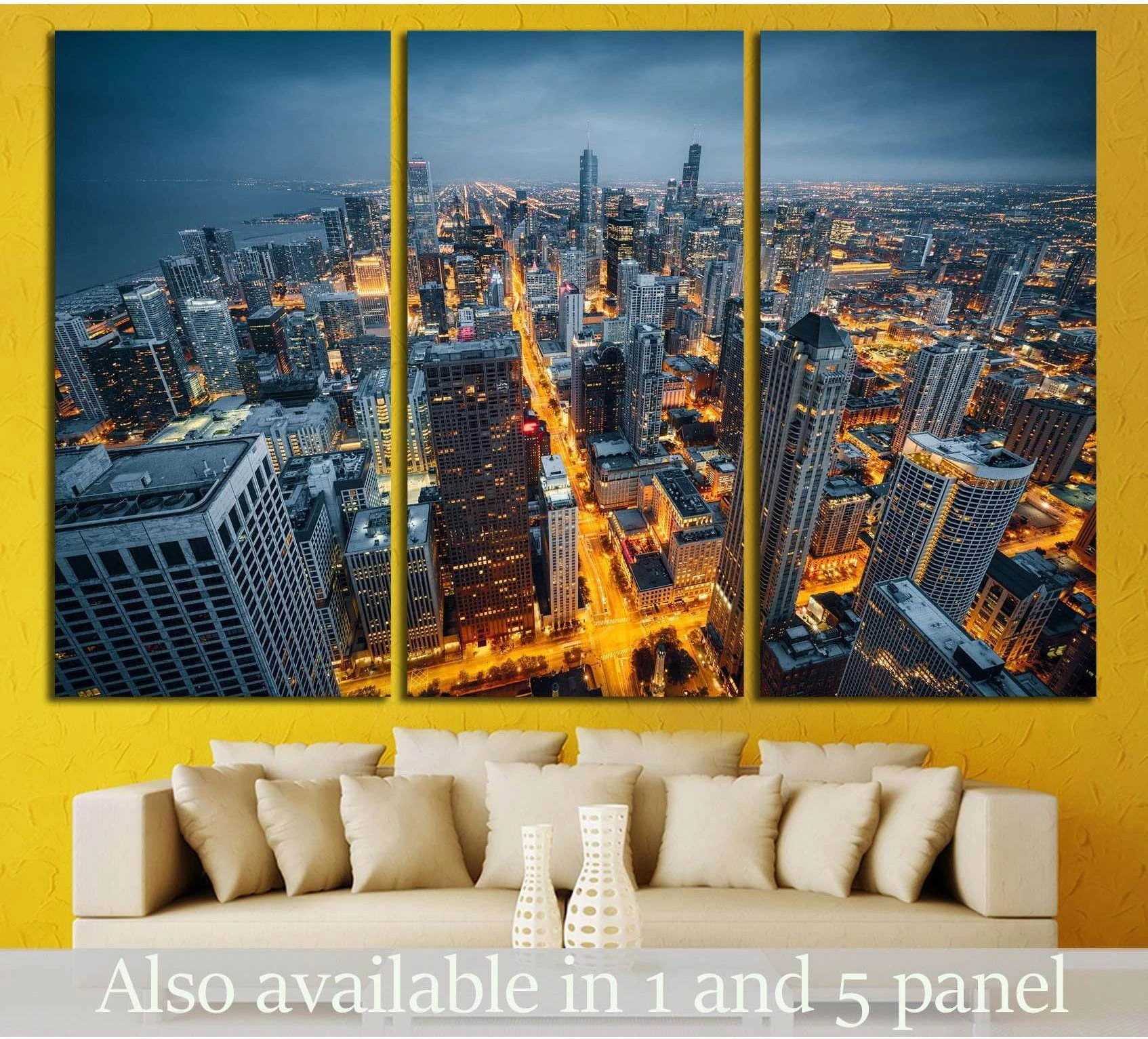 Chicago skyline triptych canvas print above sofa with aerial night city view and glowing streets