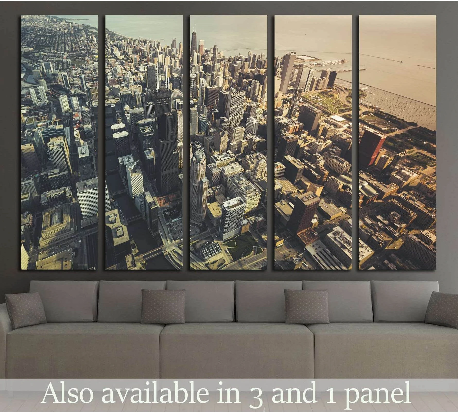 Chicago downtown aerial canvas print in muted sepia tones displayed above a sofa