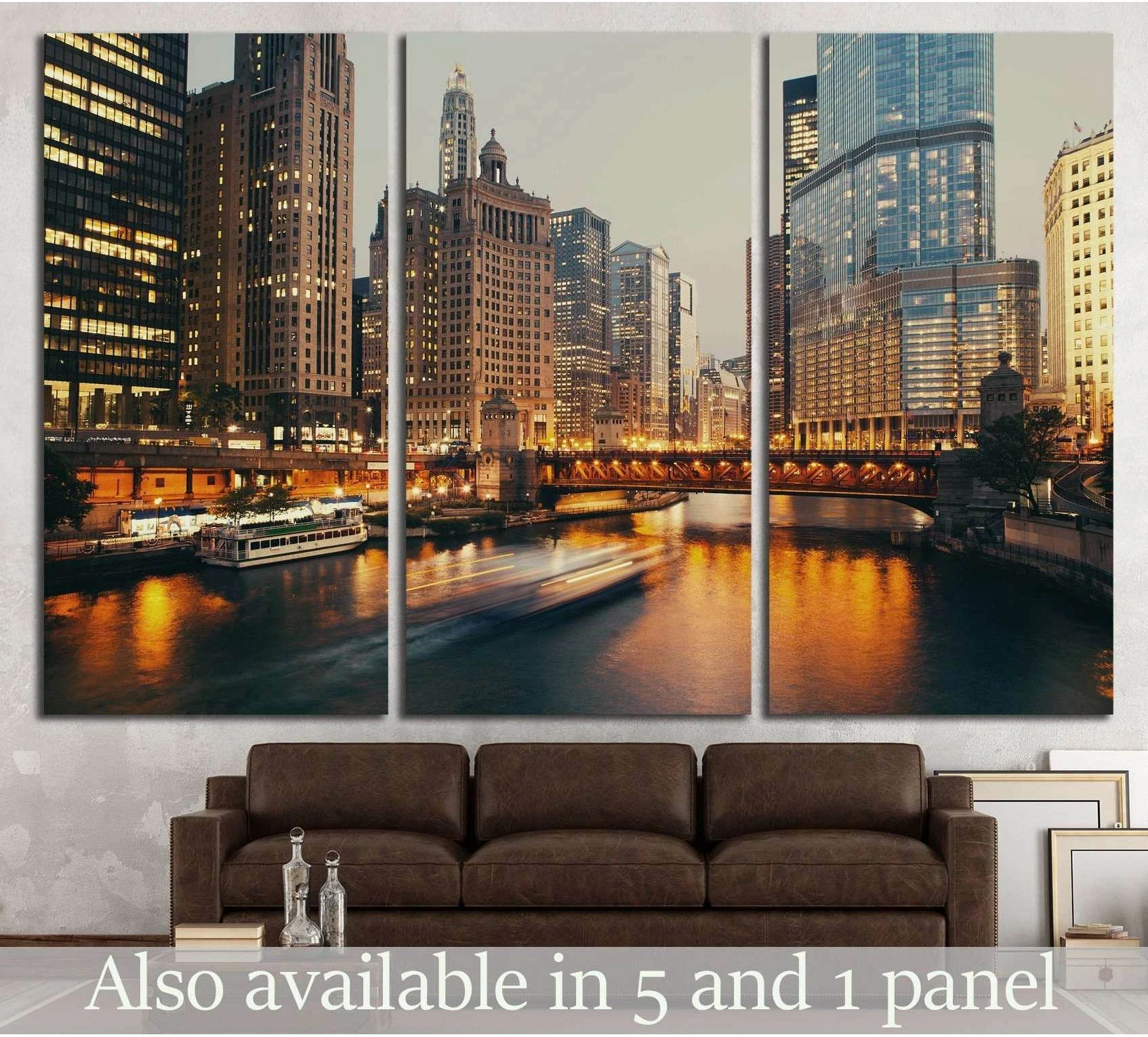 Chicago skyline triptych canvas print above a brown sofa with river reflections and downtown lights at dusk
