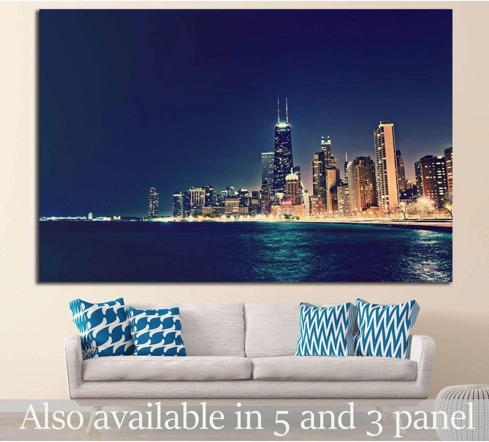 Chicago skyline canvas print above a sofa with night lakefront cityscape in deep navy and gold tones