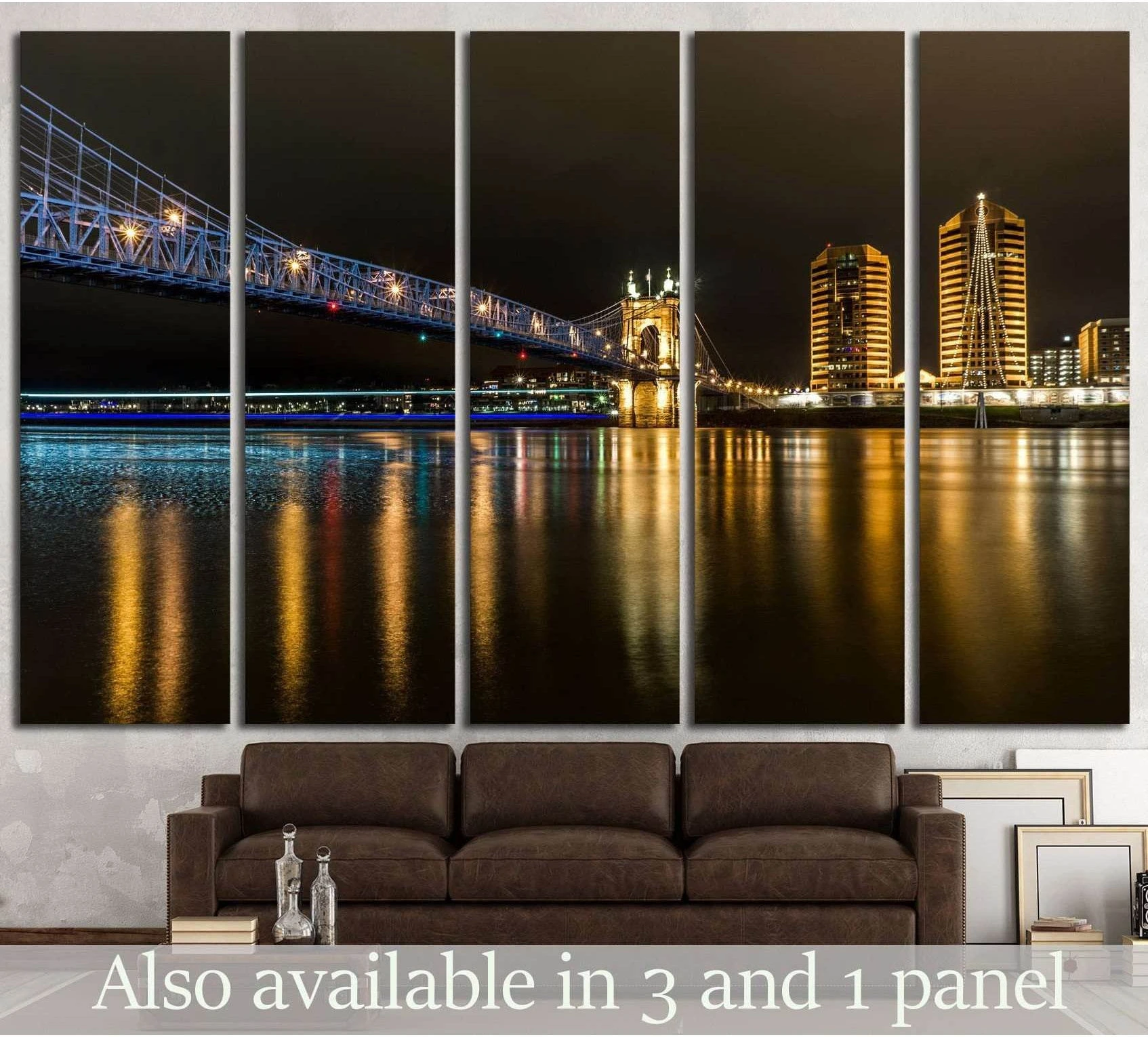 Cincinnati Roebling Bridge night canvas print above sofa with blue lights and river reflections