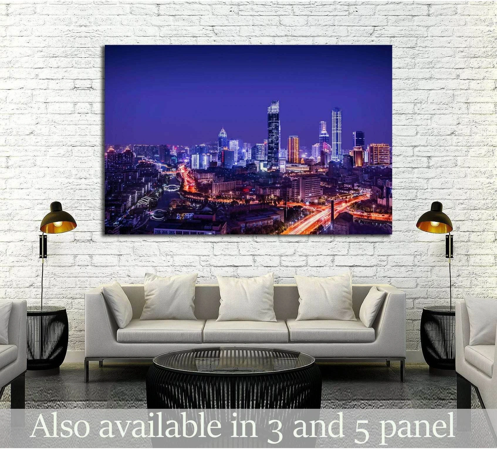Purple city skyline canvas print with glowing towers and highway light trails above a sofa