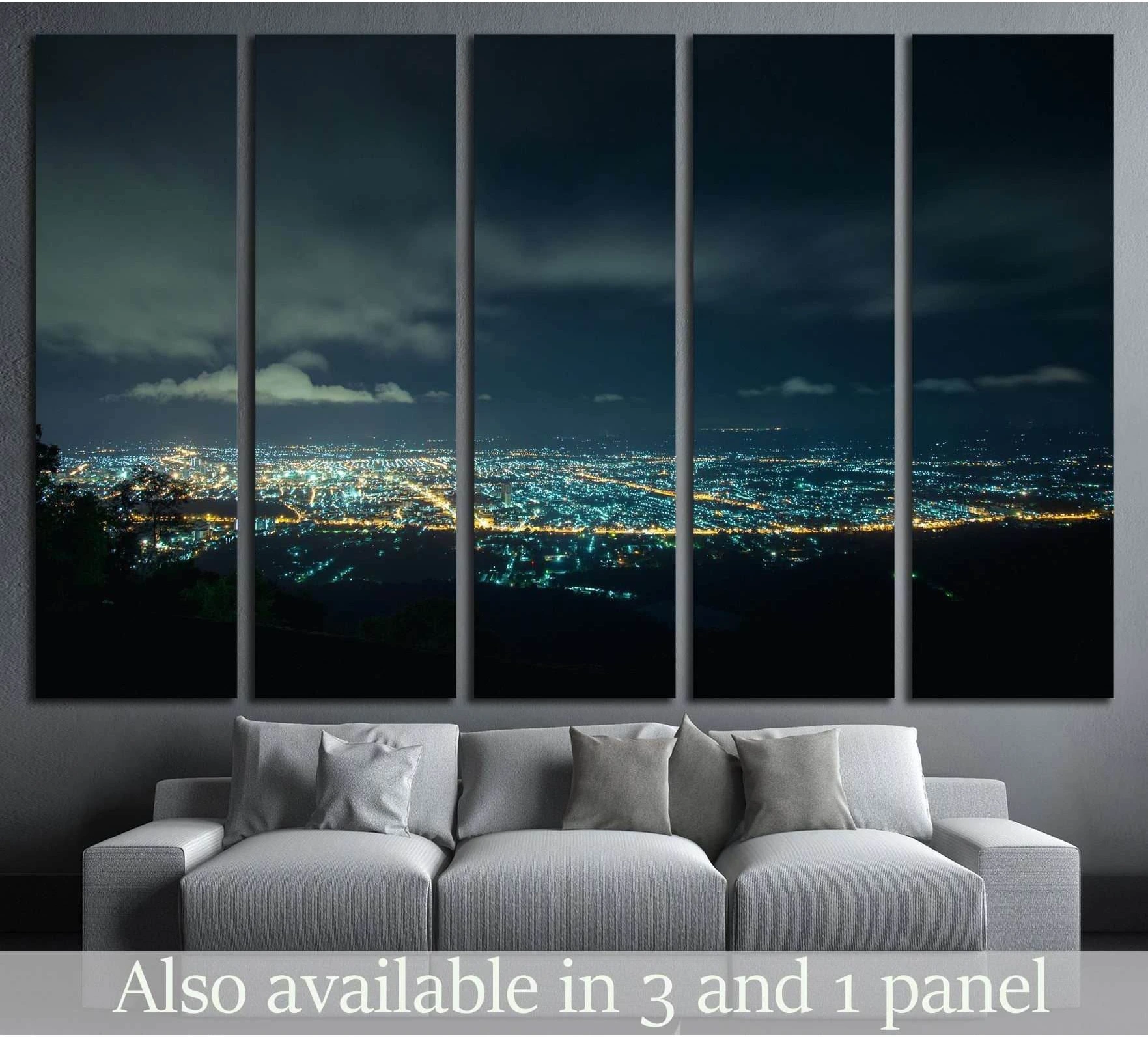 Hat Yai night cityscape canvas print hung above a gray sofa in a modern living room