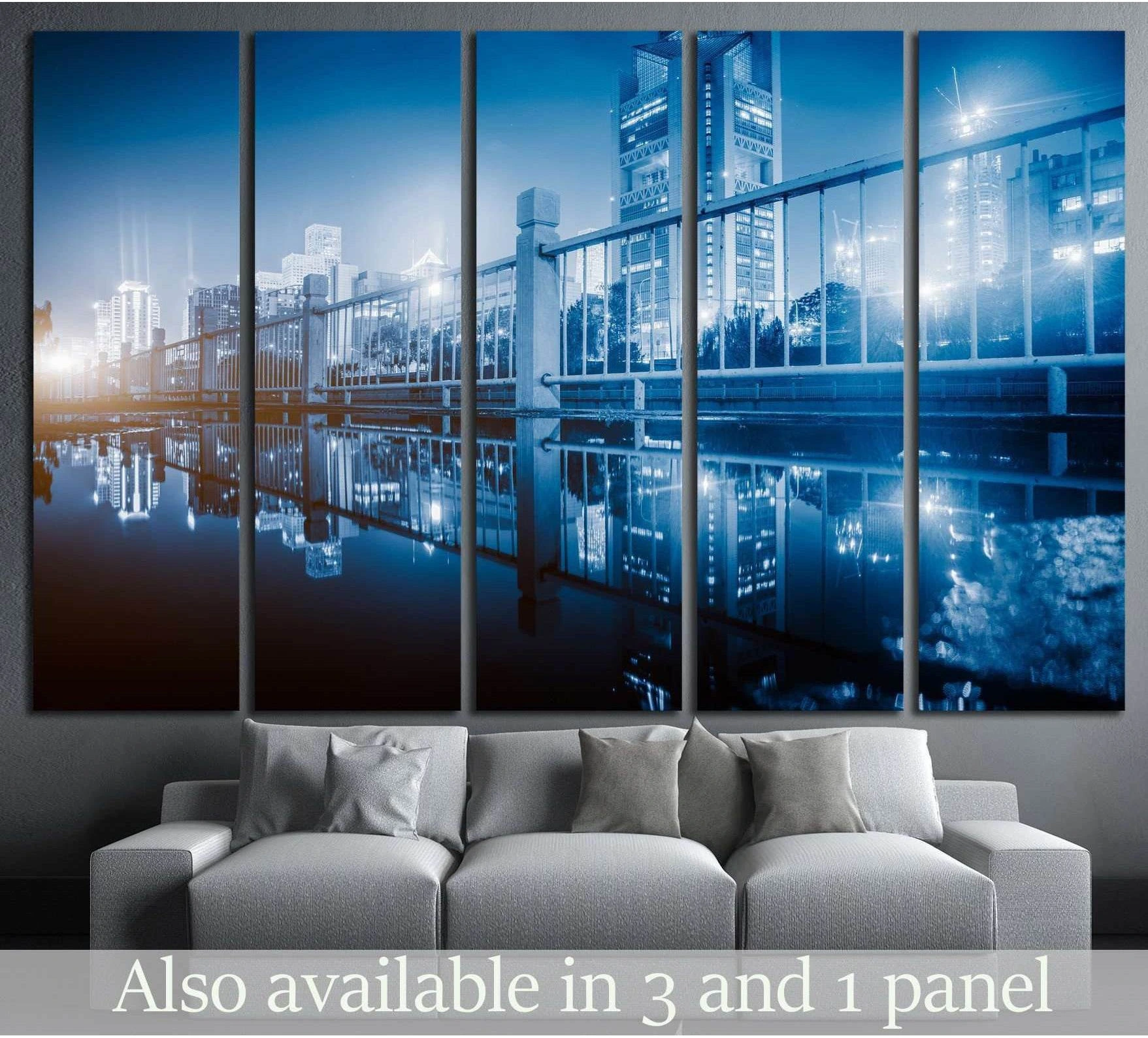 Blue city skyline canvas print with bridge railing and water reflections above a sofa