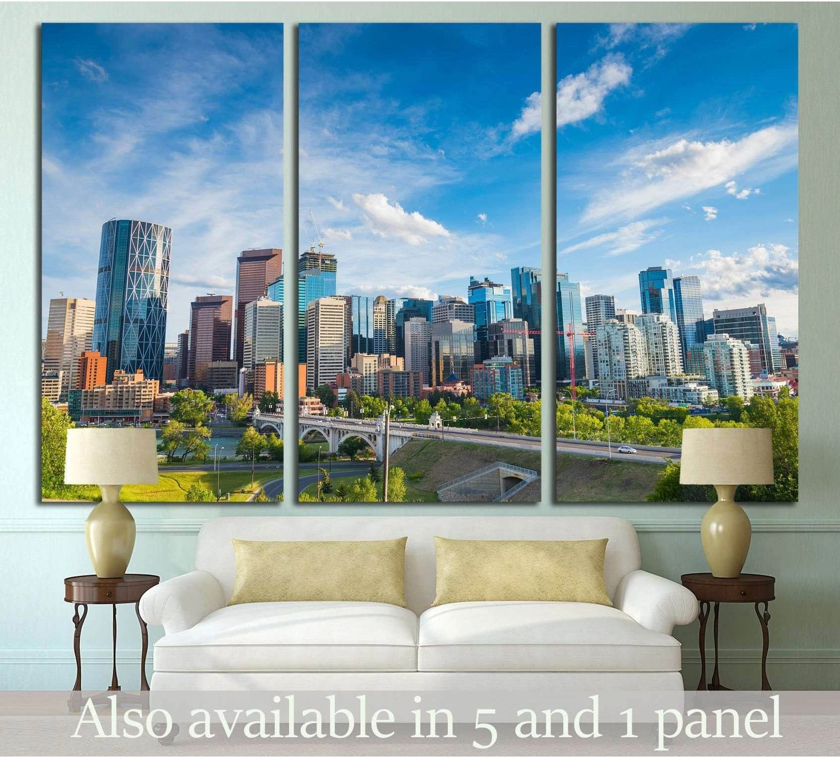 Calgary skyline triptych canvas print above sofa with blue sky, downtown towers, and riverfront