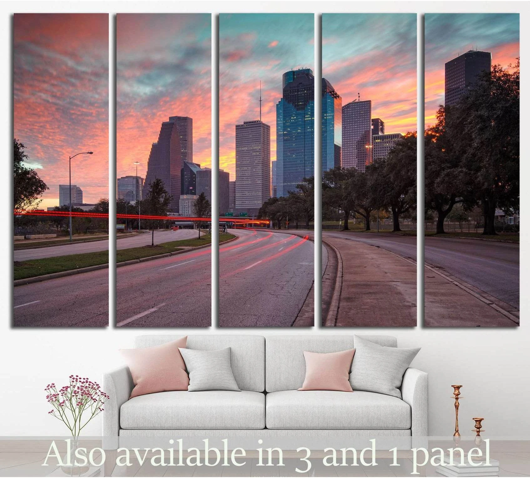 Five-panel city skyline canvas print with pink teal sunset and road light trails above a sofa