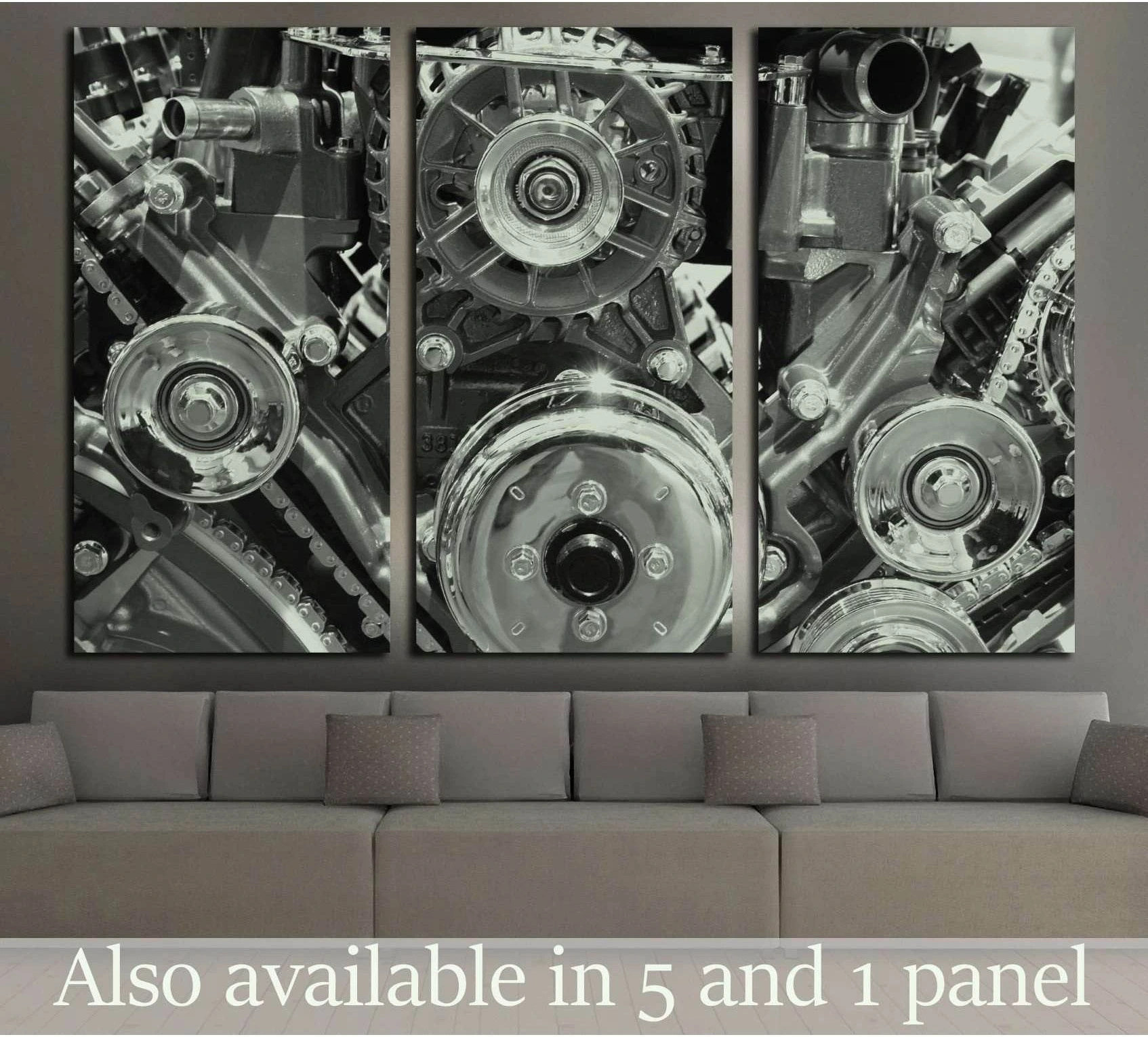 Black and white engine triptych canvas print with chrome pulleys above a gray sofa