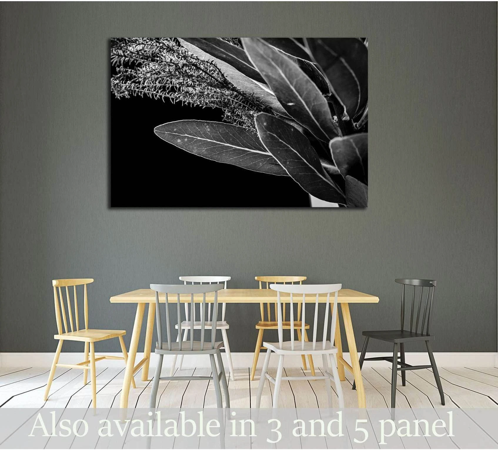 Black and white protea leaf close-up canvas print above dining table in a modern minimalist room