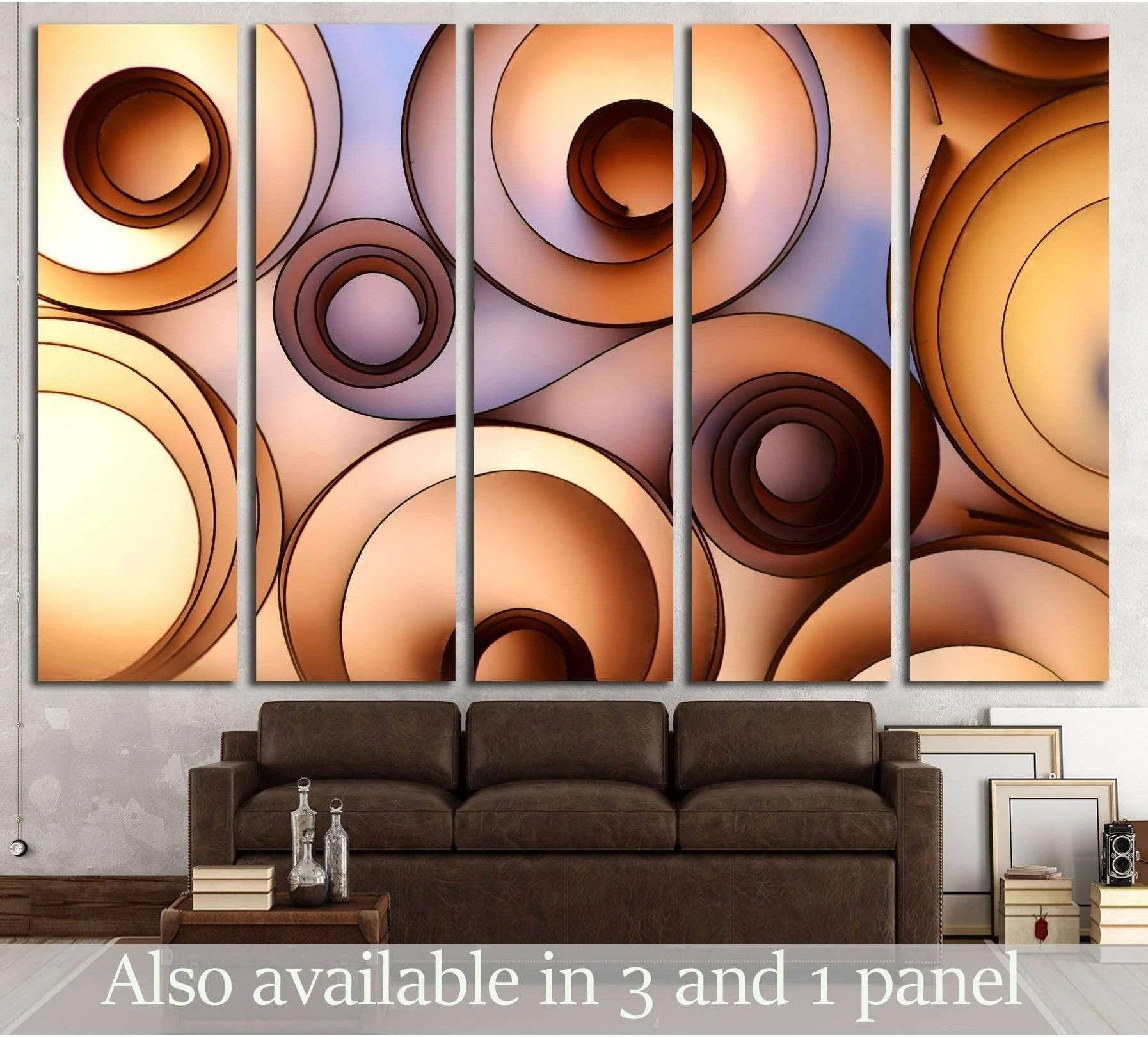 Abstract circle canvas print with layered caramel and tan concentric forms above a brown sofa