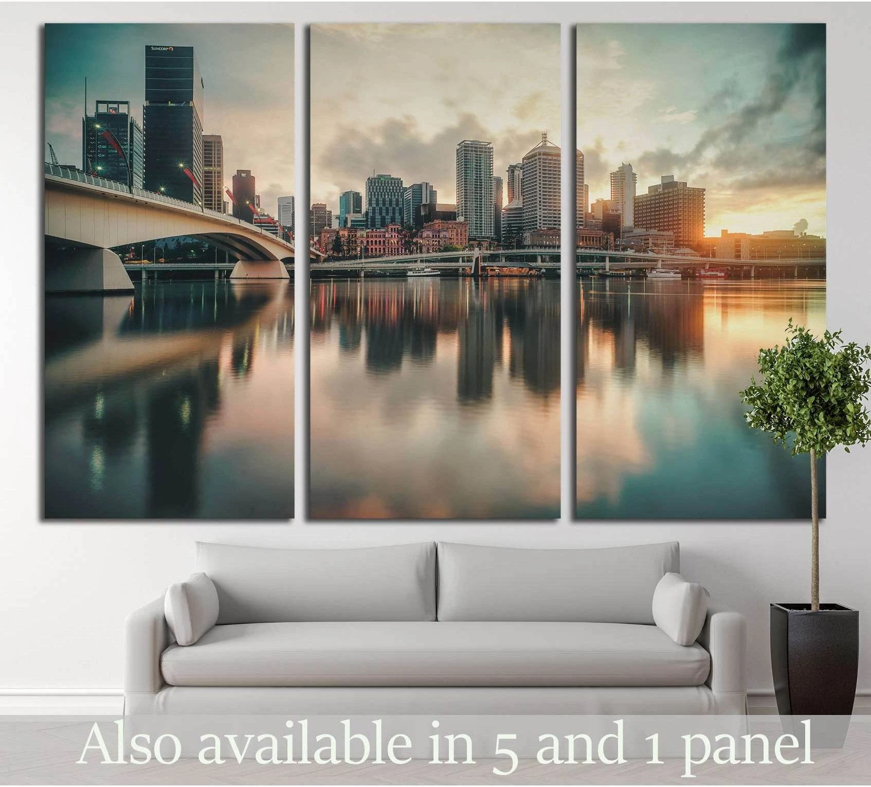 Brisbane skyline triptych canvas print with sunrise reflections above sofa in a modern living room