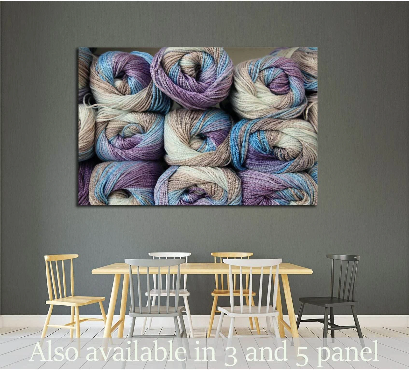Pastel yarn canvas print with stacked lavender, blue, and cream skeins above a dining table