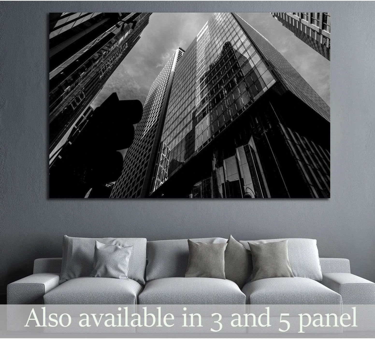 Black and white Hong Kong skyscraper canvas print hung above sofa in modern living room