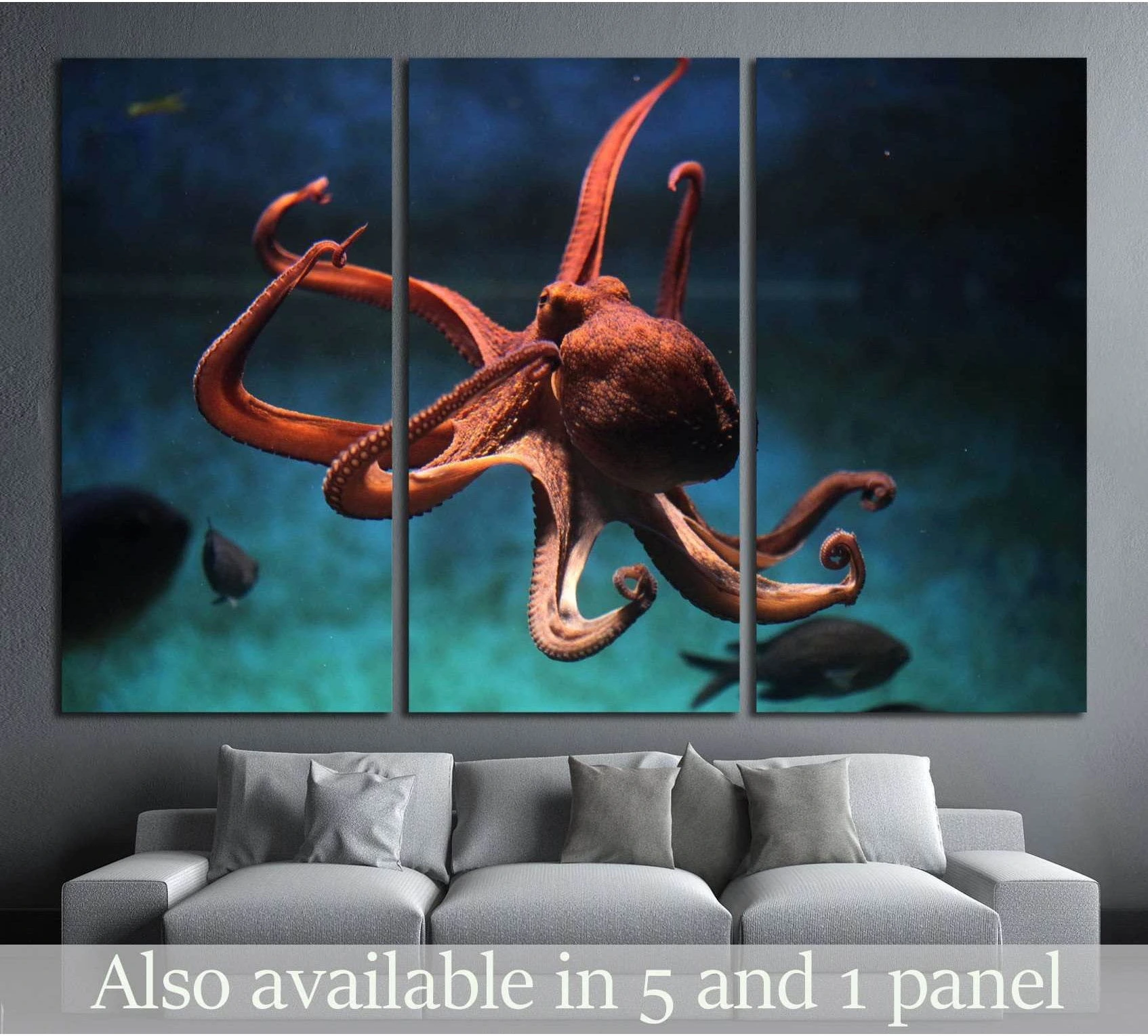 Orange common octopus canvas print in deep blue water displayed above a sofa in a modern living room