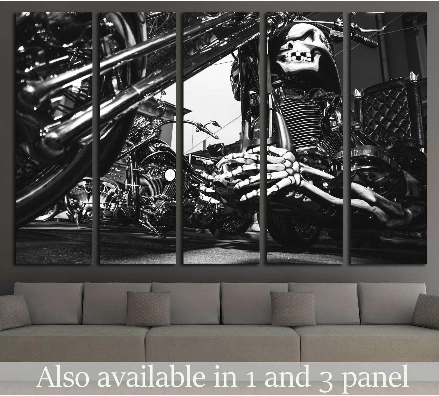 Black and white motorcycle skull canvas print in 5 panels displayed above a sofa in a modern living room