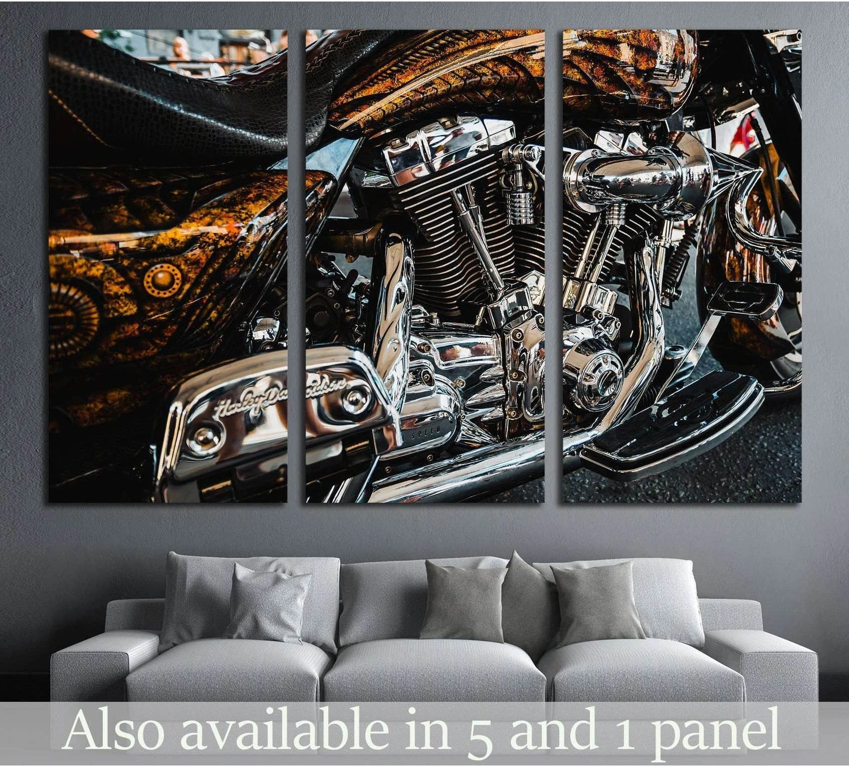 Triptych motorcycle engine canvas print with chrome detail above gray sofa in modern living room