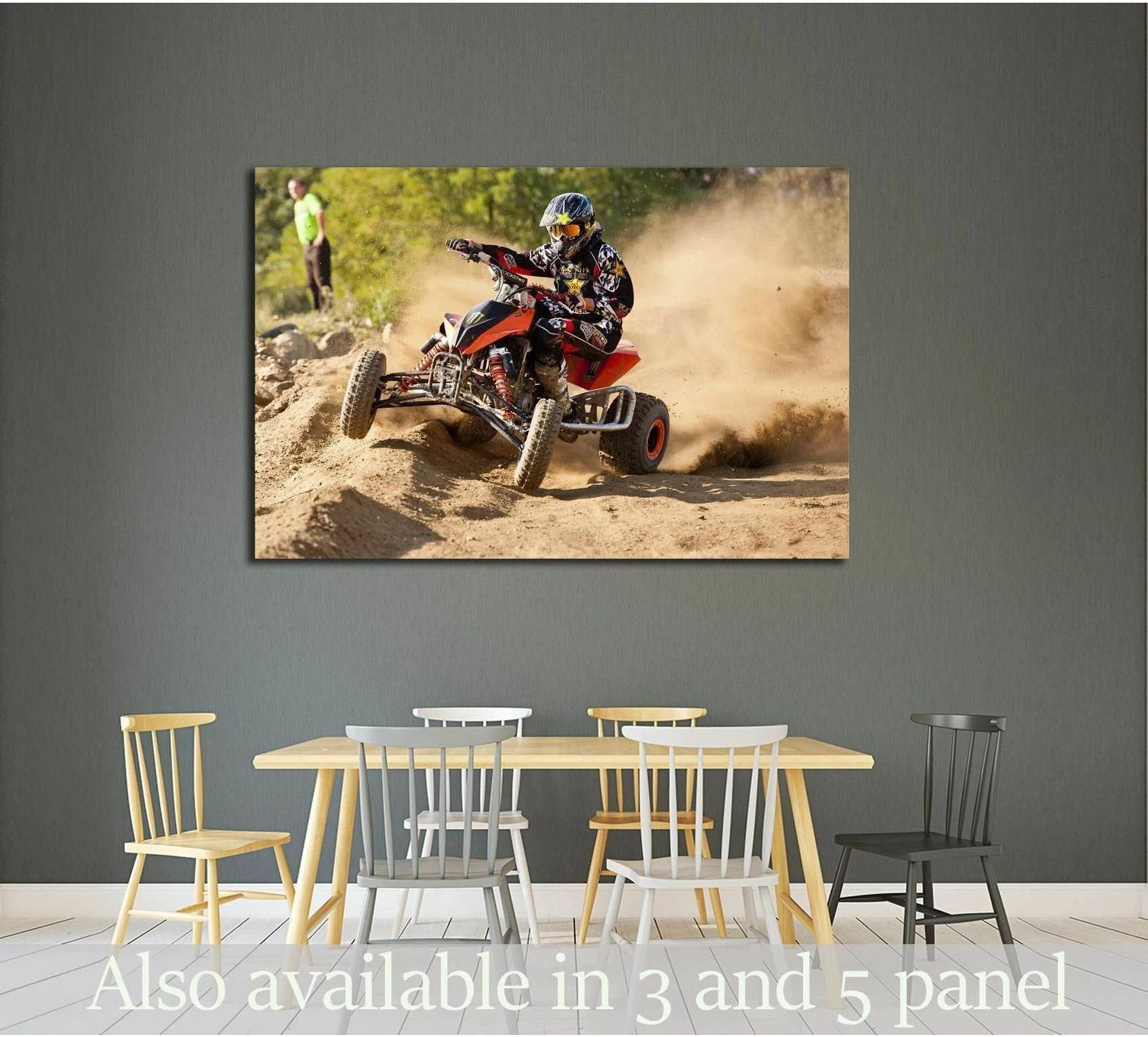 ATV racing canvas print above dining table showing rider drifting through a dusty off-road turn