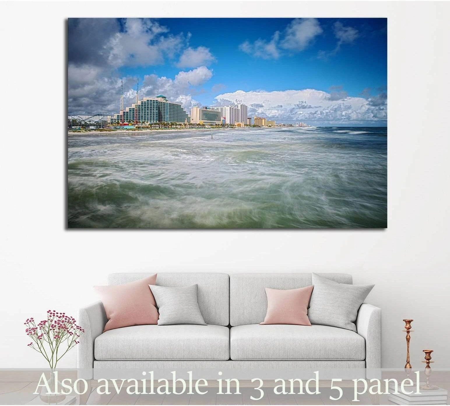 Daytona Beach shoreline canvas print with surf, beachfront hotels, and blue sky above a sofa
