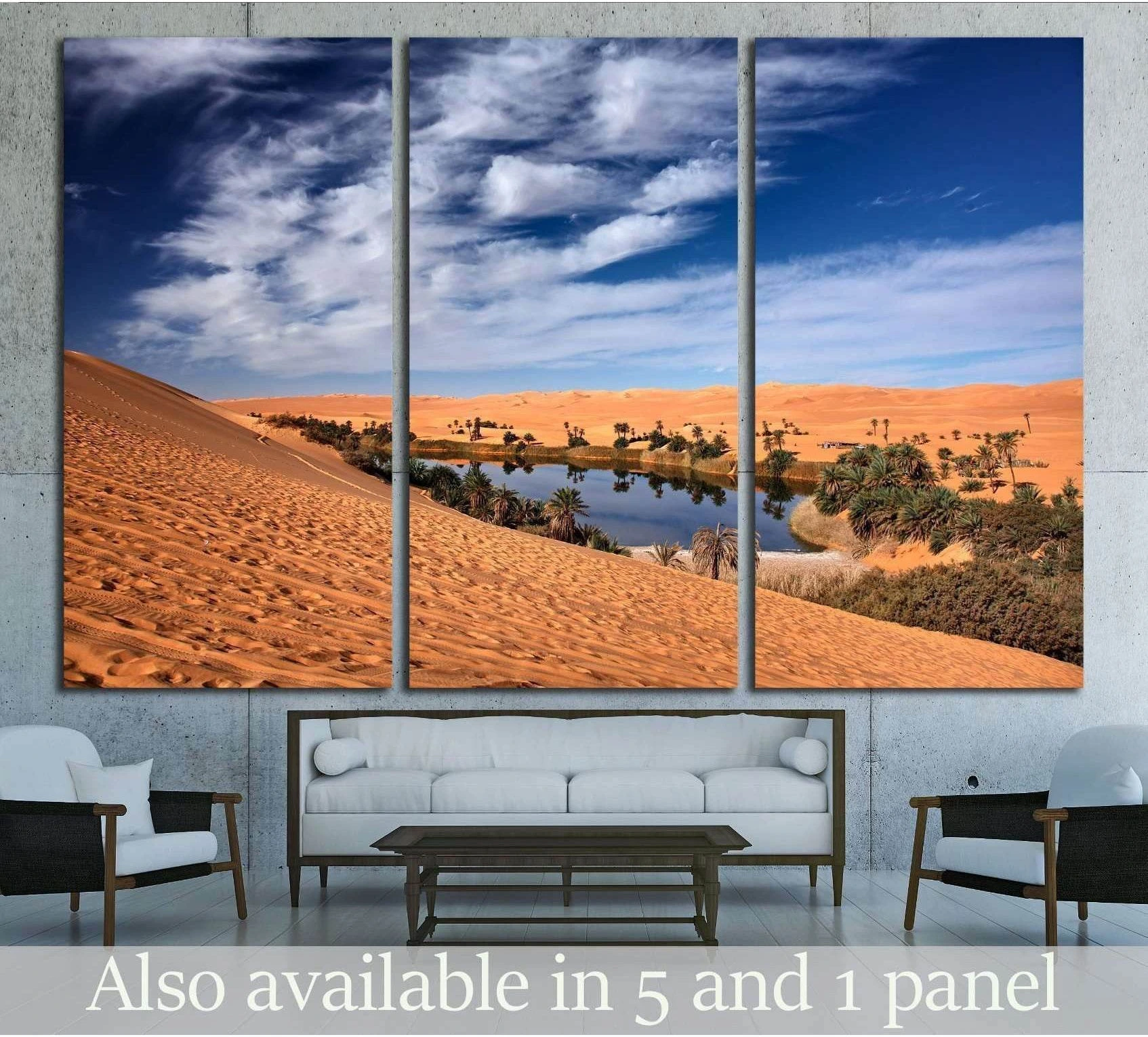 Sahara oasis triptych canvas print with orange dunes, palms, and water above a sofa