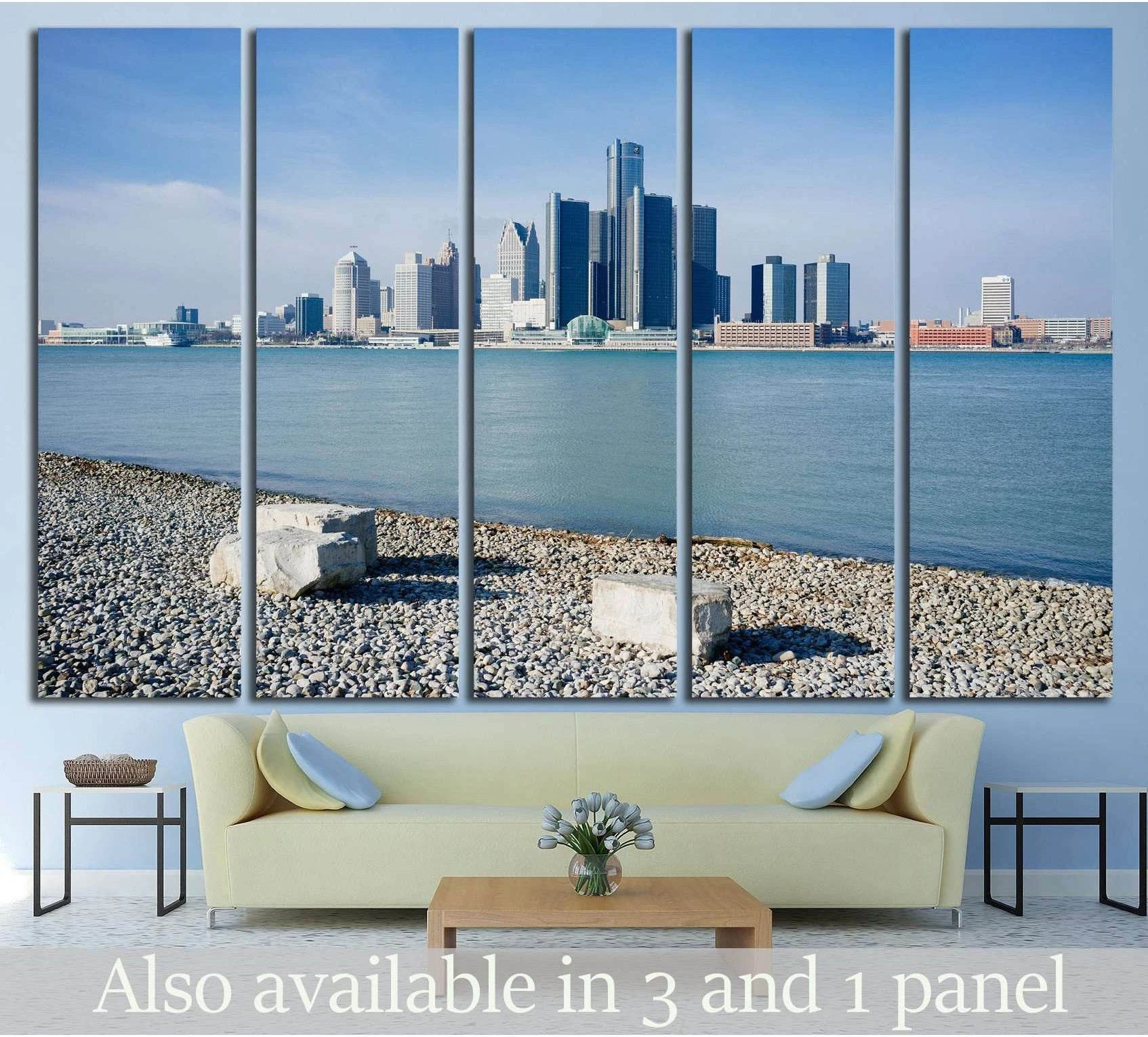 Detroit skyline multi-panel canvas print above sofa with Windsor riverfront, blue water, and pebble shore