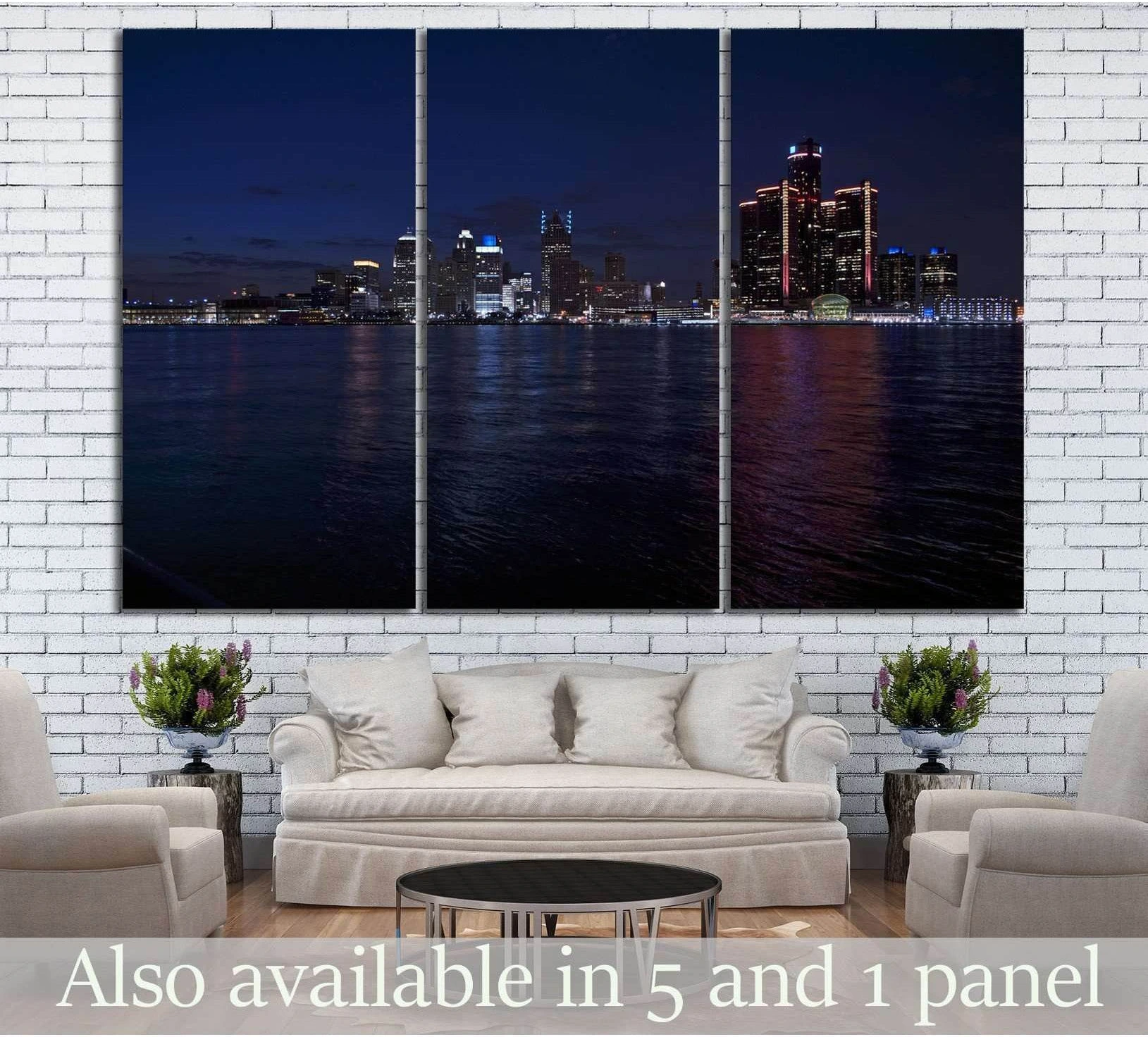 Detroit skyline canvas print at night displayed above a sofa in a modern living room