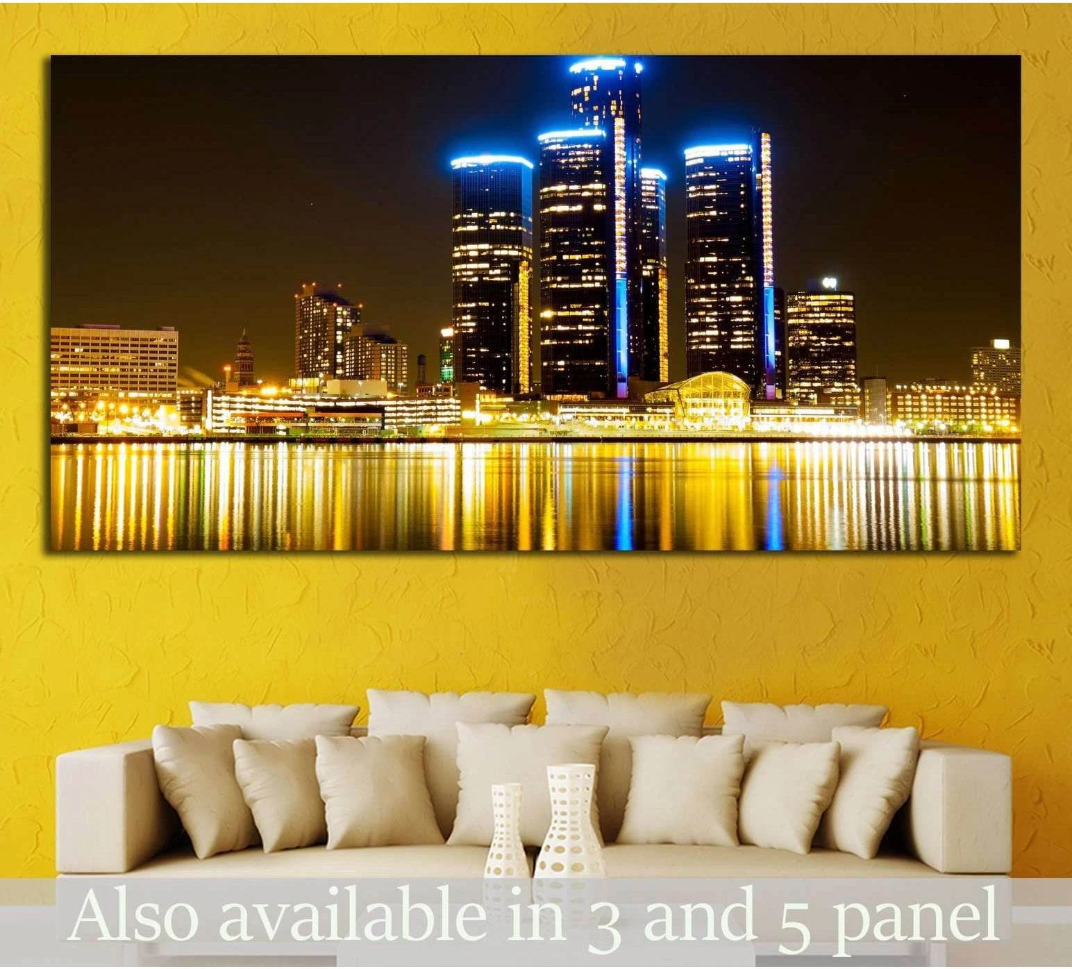 Detroit skyline canvas print with blue-lit Renaissance Center and gold reflections, displayed above a sofa in a modern living room