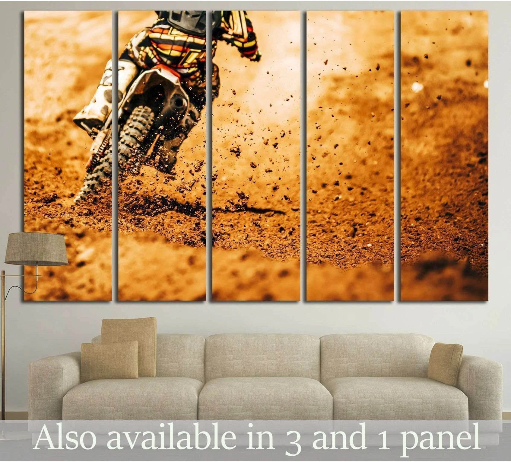 Motocross rider dirt bike canvas print kicking up mud in warm orange earth tones above a sofa