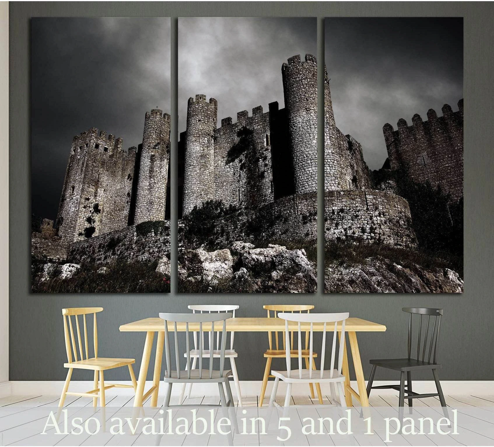 Medieval castle canvas print with stormy night sky displayed above dining table in modern room