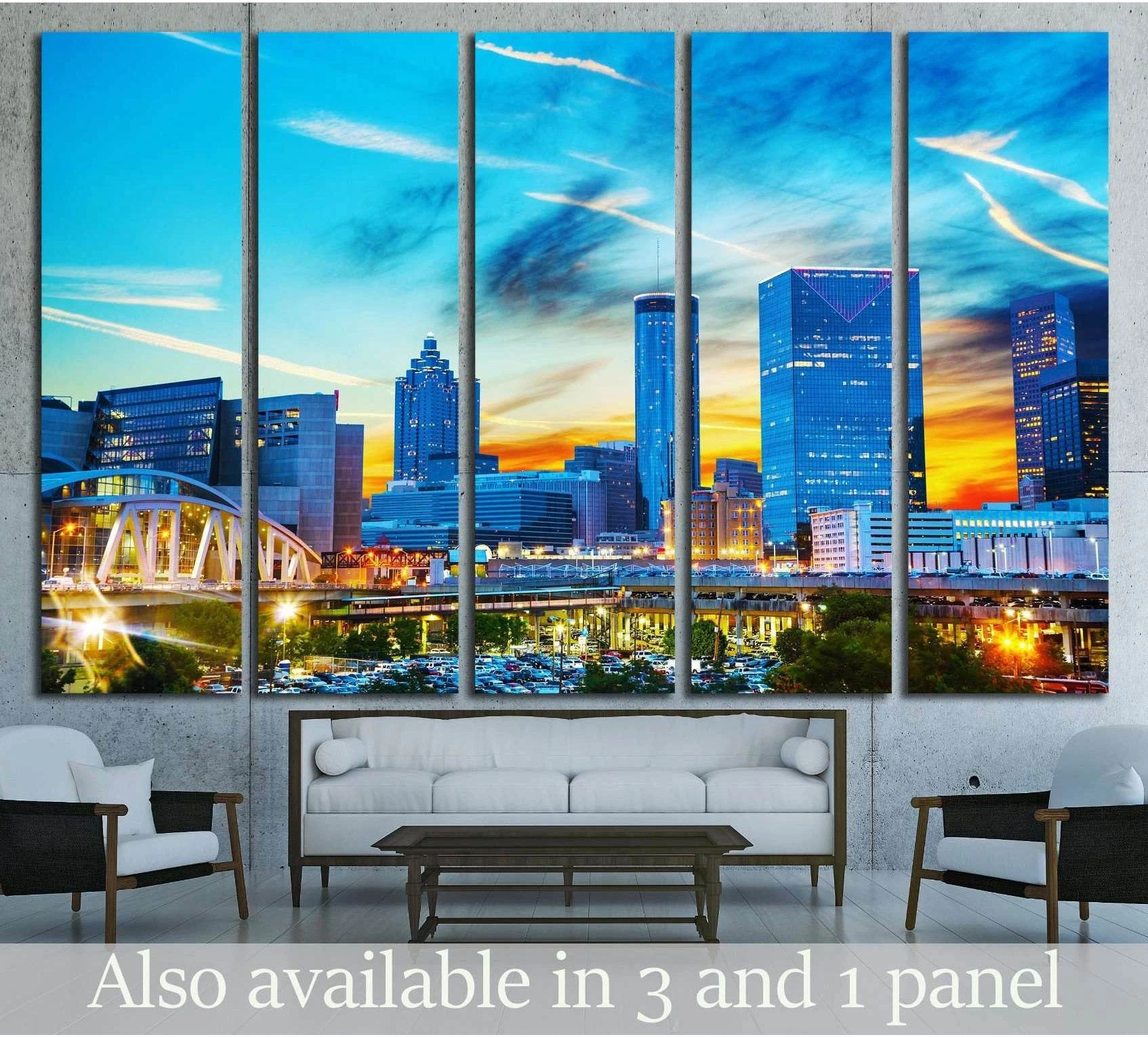 Atlanta skyline canvas print at sunset displayed as five panels above a sofa in a modern living room