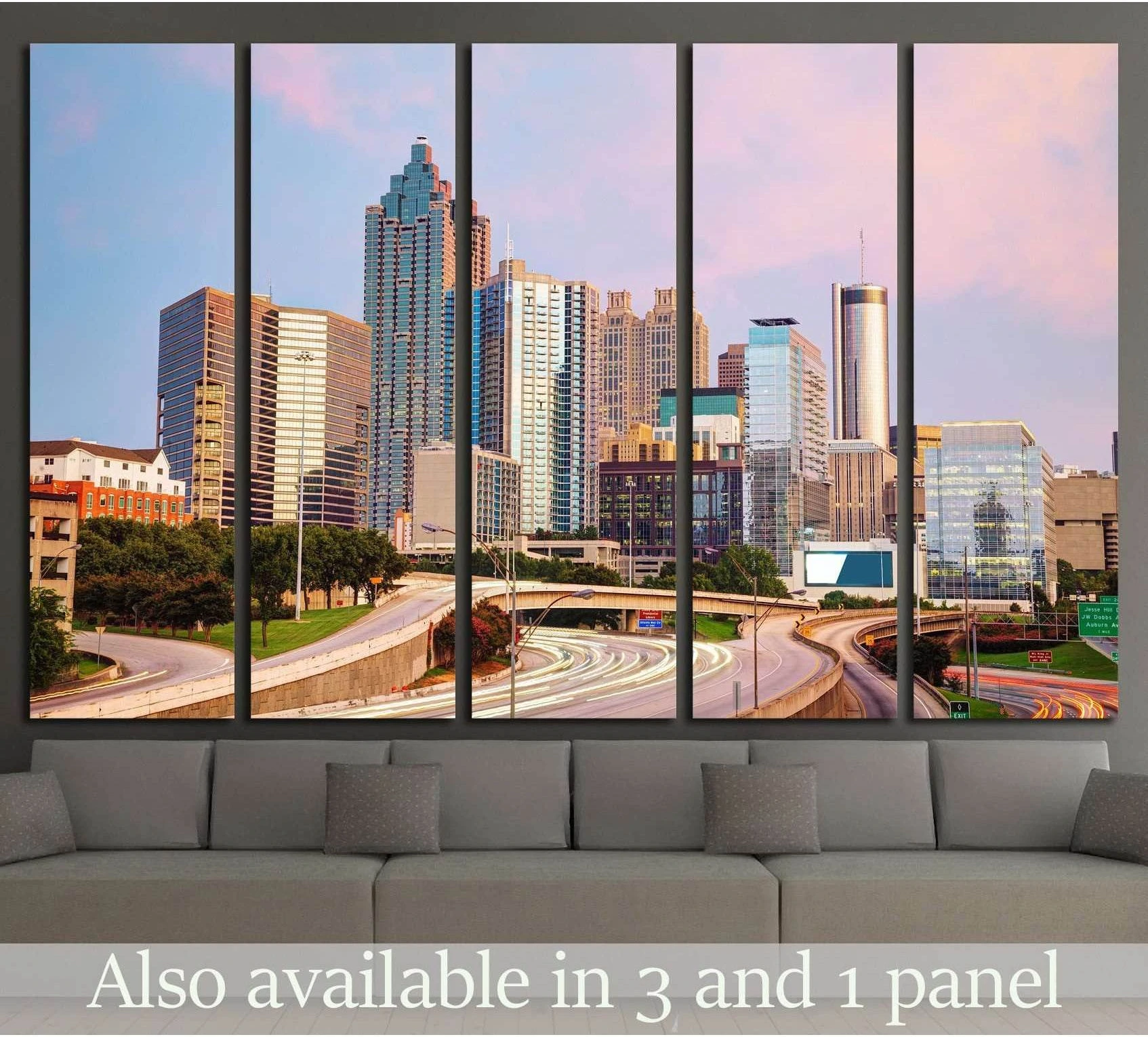 Atlanta skyline sunset canvas print hung above a sofa in a modern living room with highway light trails