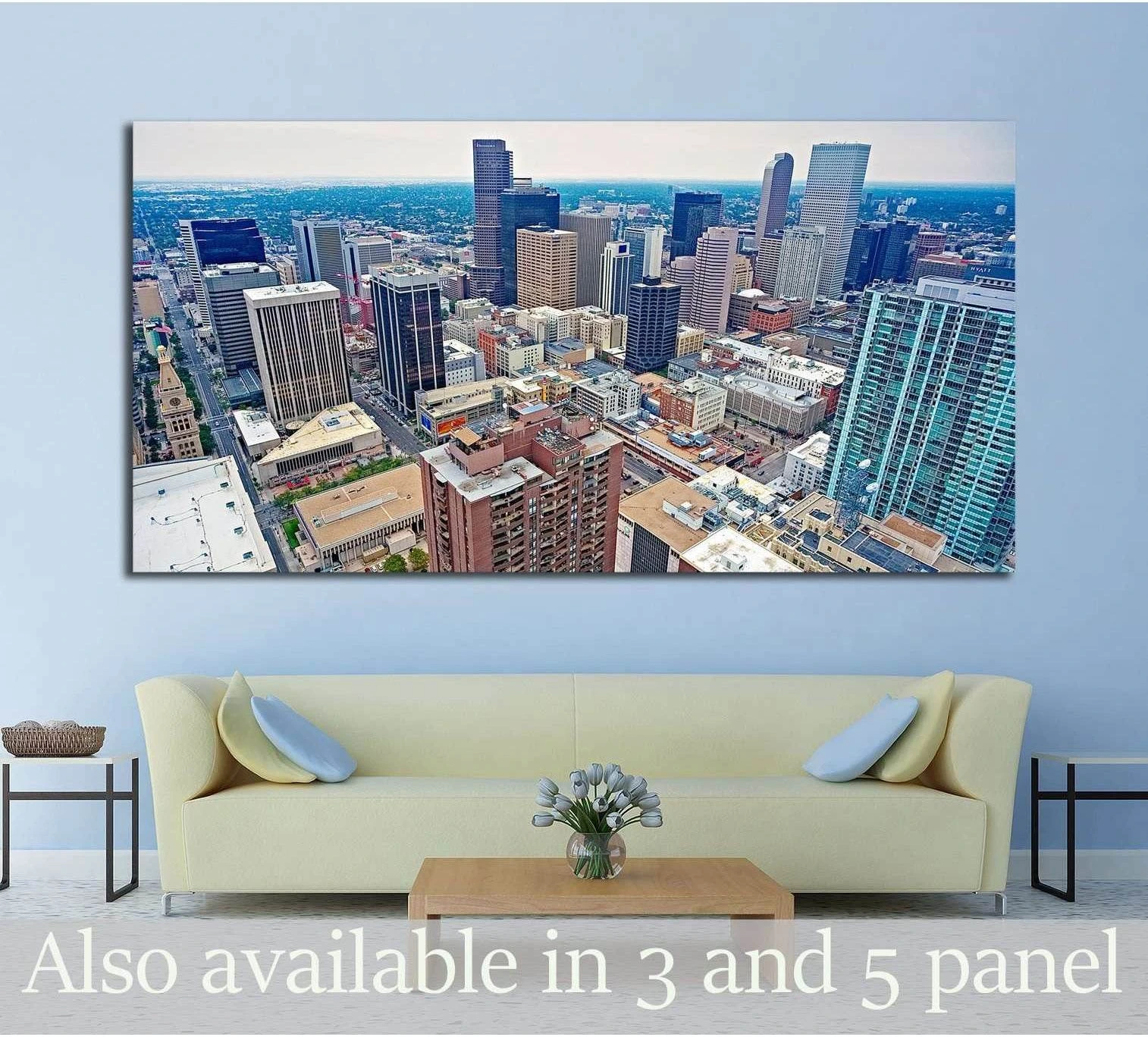 Aerial Downtown Denver skyline canvas print hung above a sofa in a modern living room