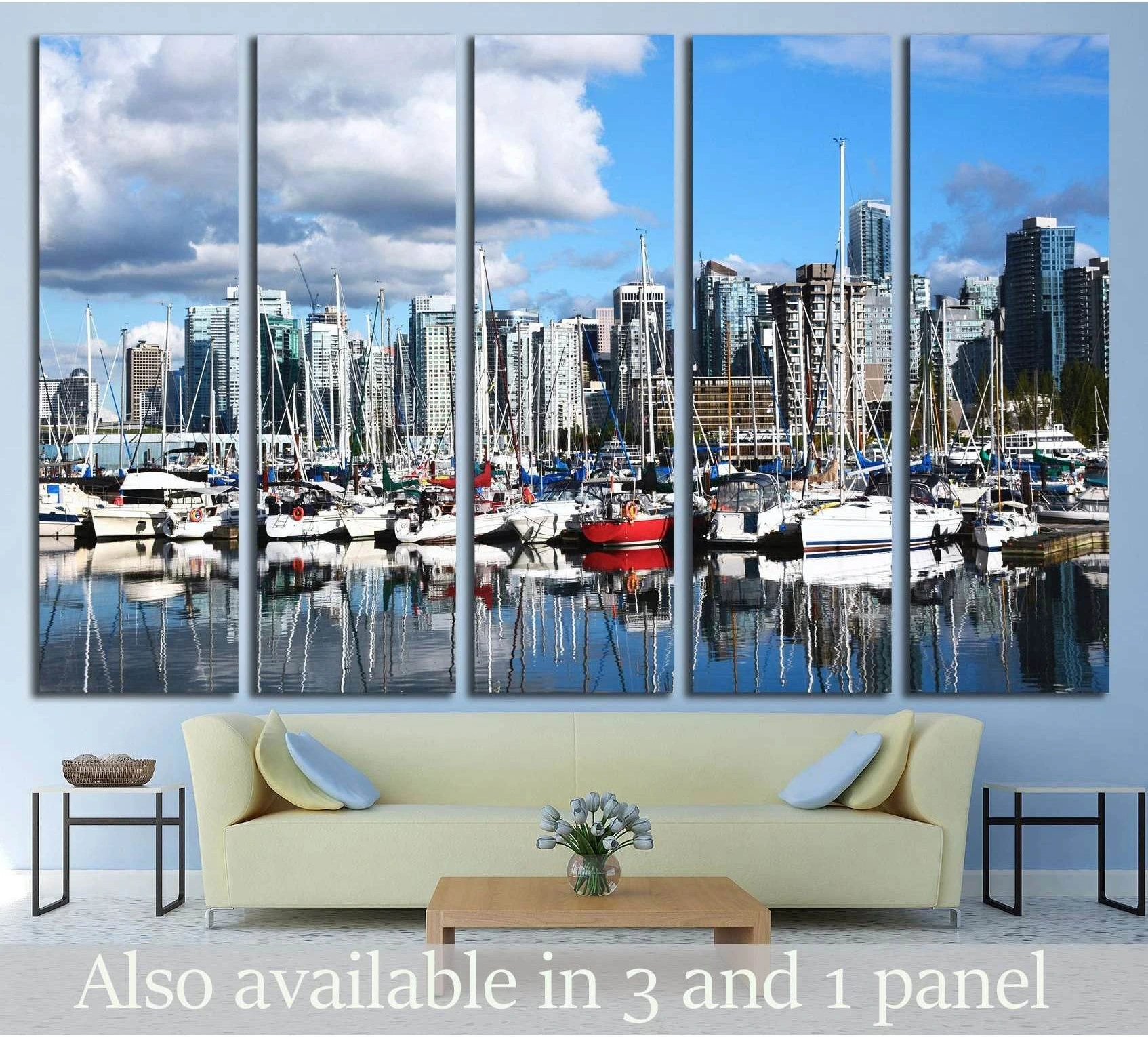 City marina skyline canvas print with sailboats and reflections hung above a sofa in a modern living room