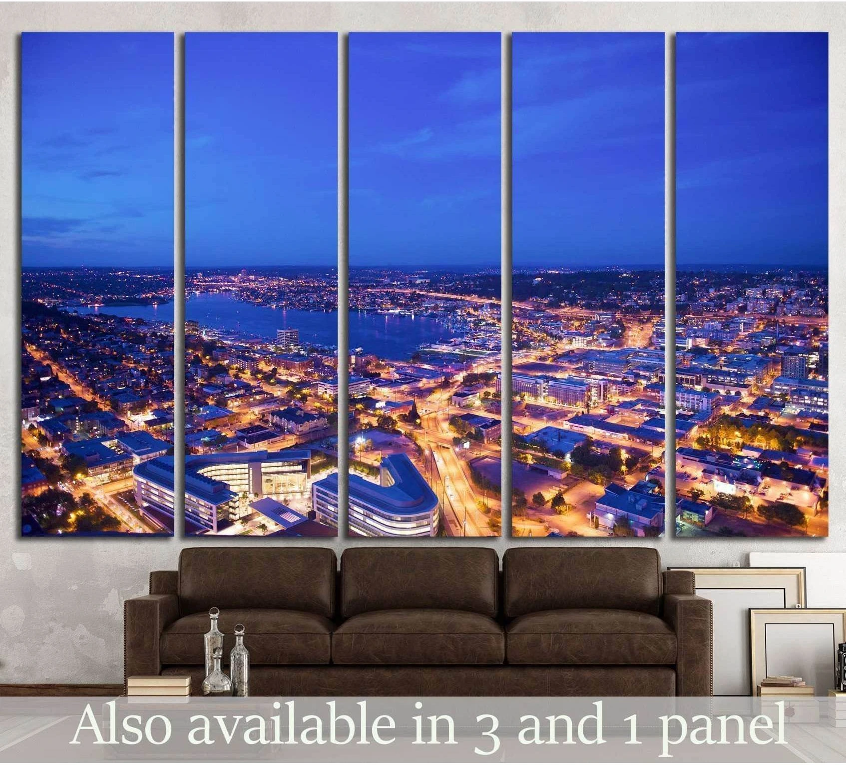 Seattle skyline canvas print with downtown aerial night view above a sofa in a modern living room