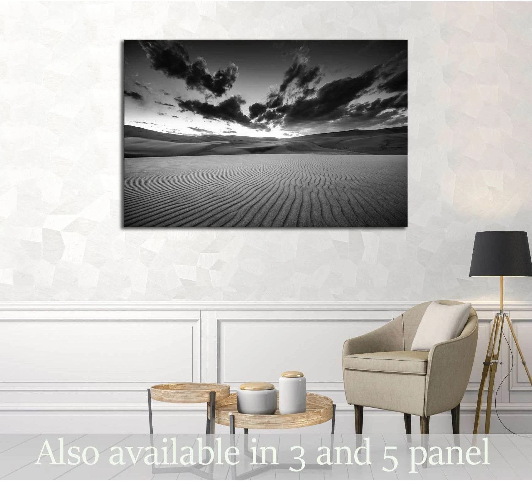 Black and white desert dunes canvas print with rippled sand and dramatic clouds above a sofa