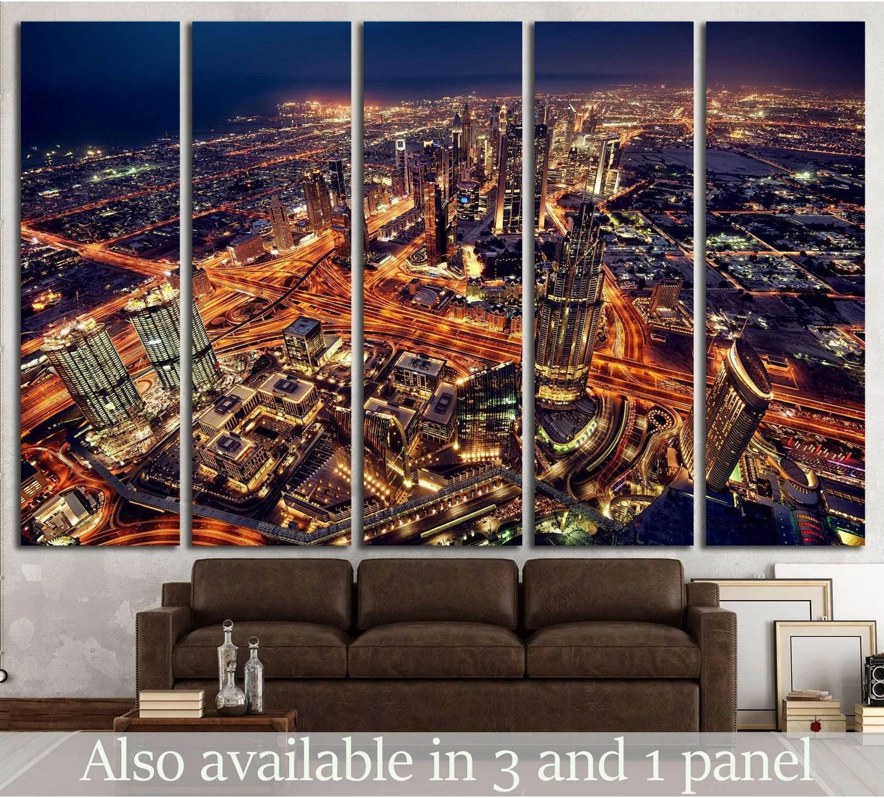 Dubai skyline canvas print with glowing night city lights above sofa in modern living room