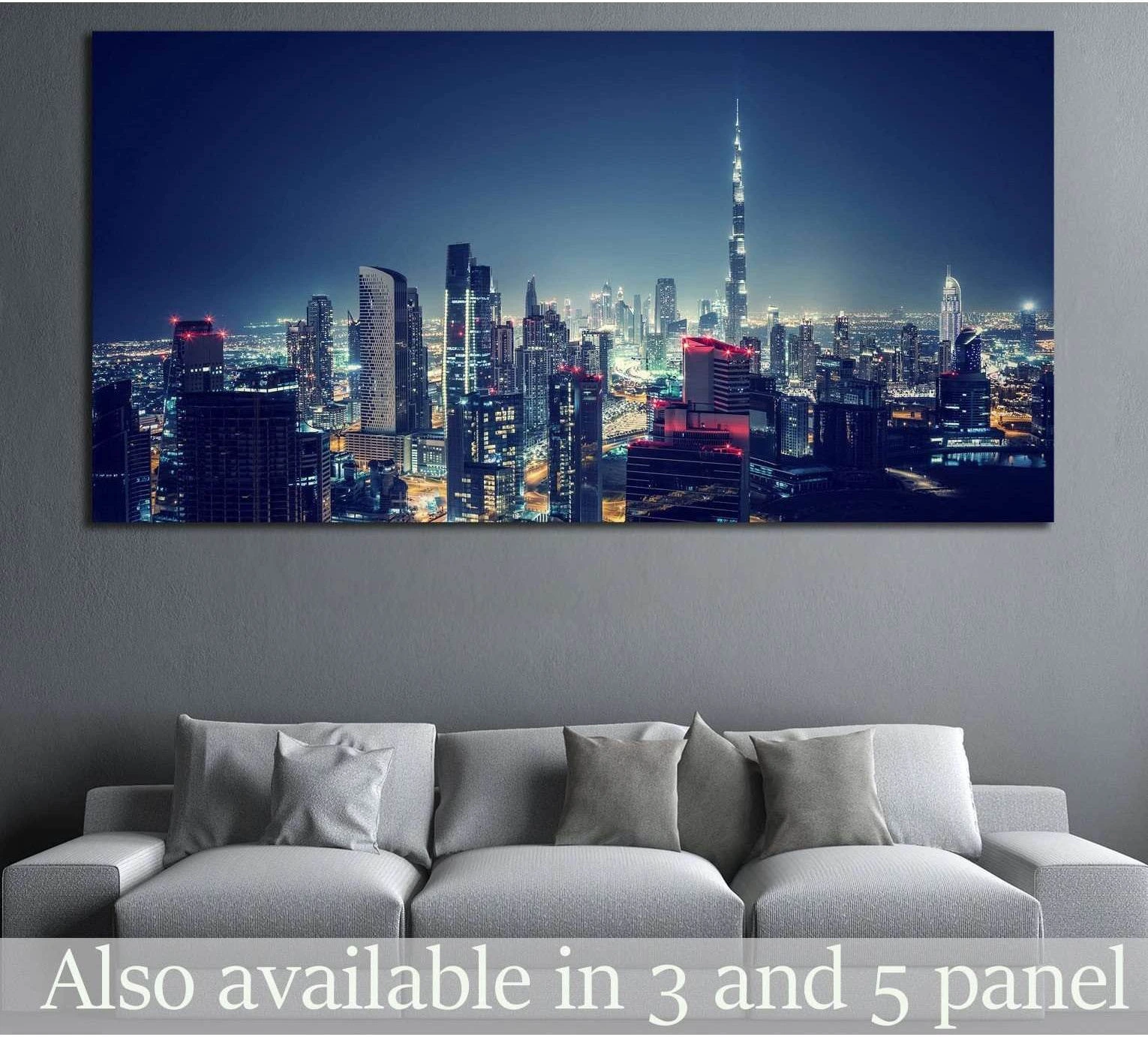 Dubai skyline canvas print with Burj Khalifa at night above a sofa in a modern living room