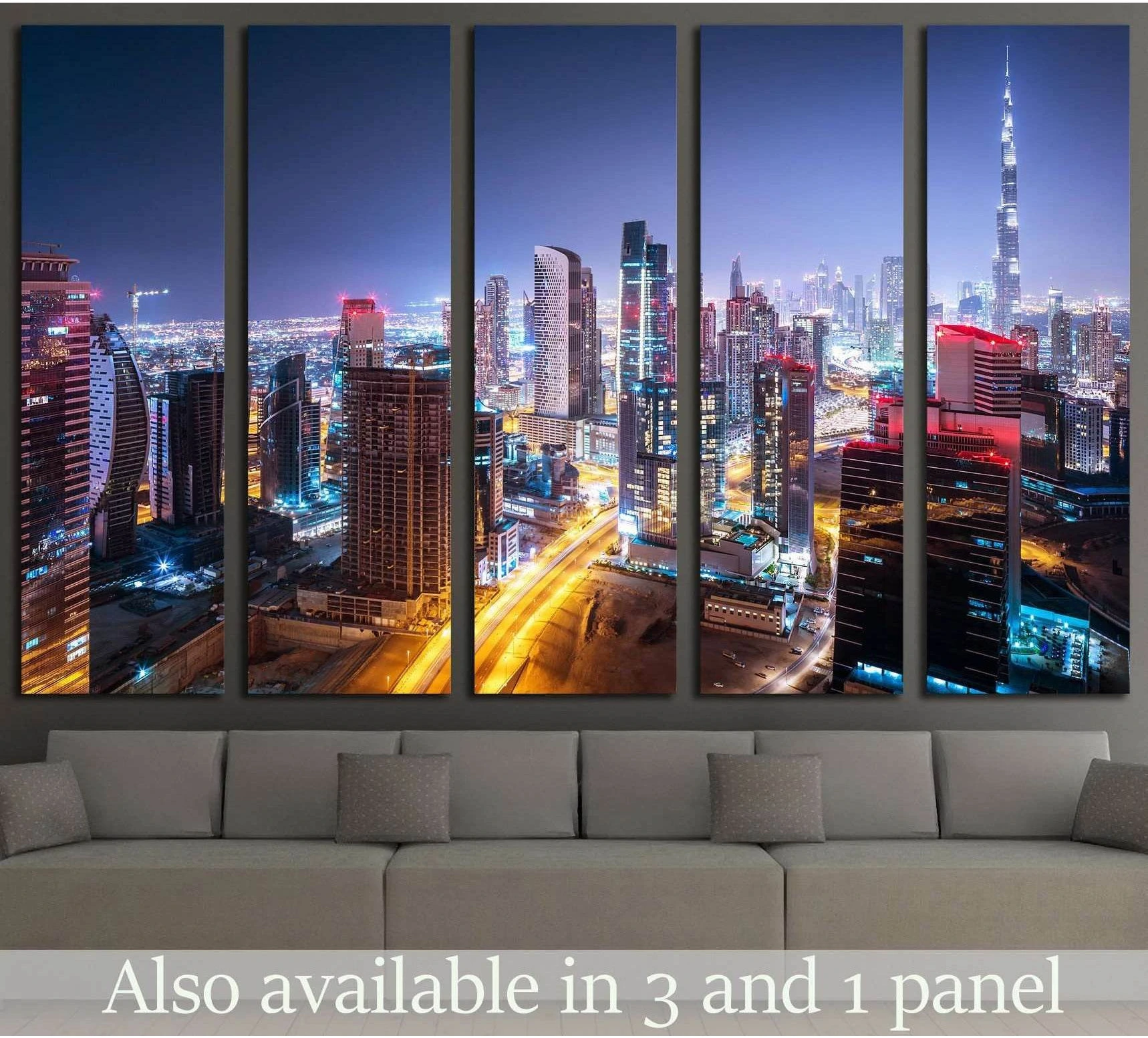 Dubai skyline canvas print with Burj Khalifa at night, displayed above a sofa in a modern living room