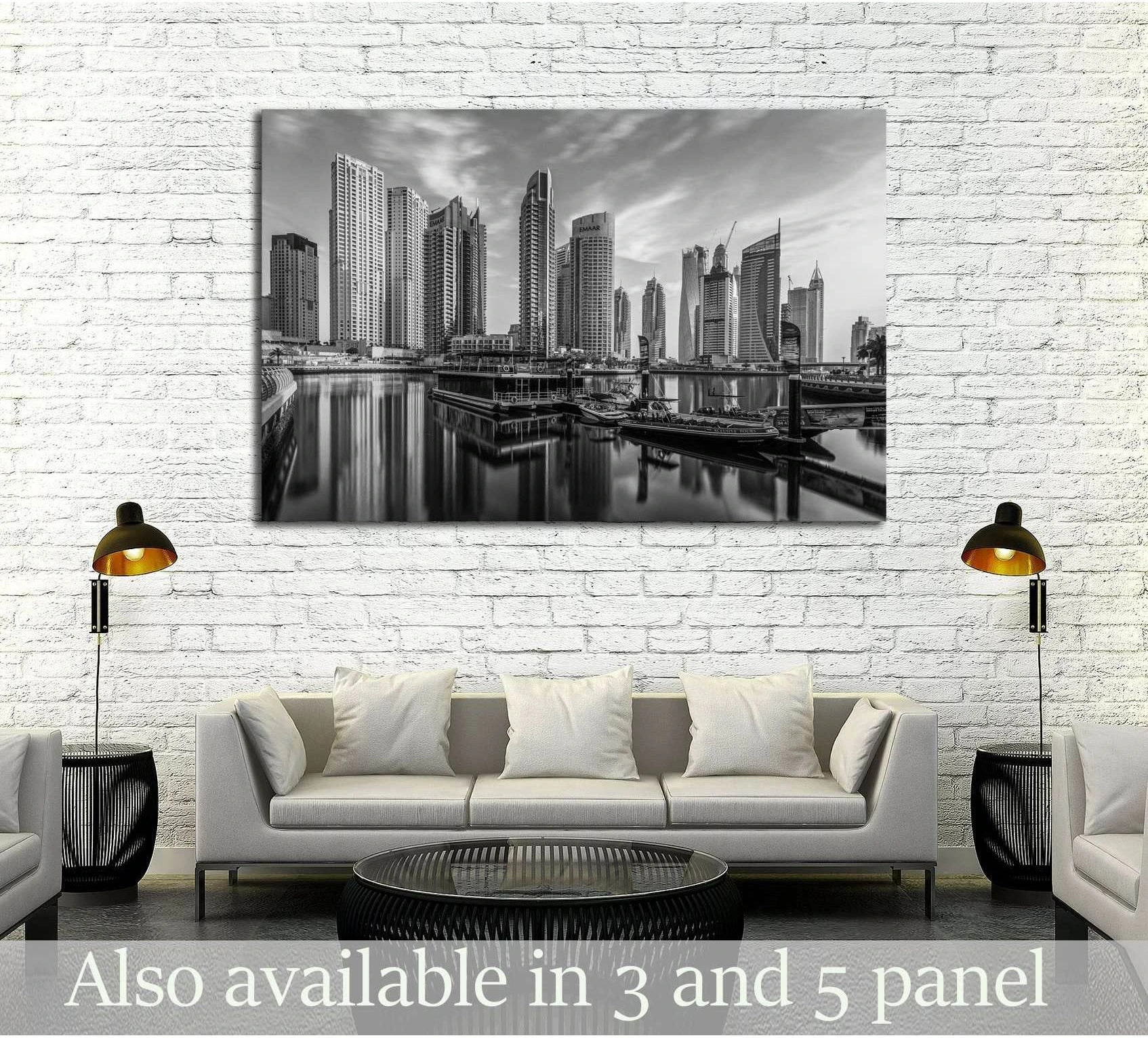 Black and white Dubai Marina skyline canvas print hung above a sofa in a modern living room