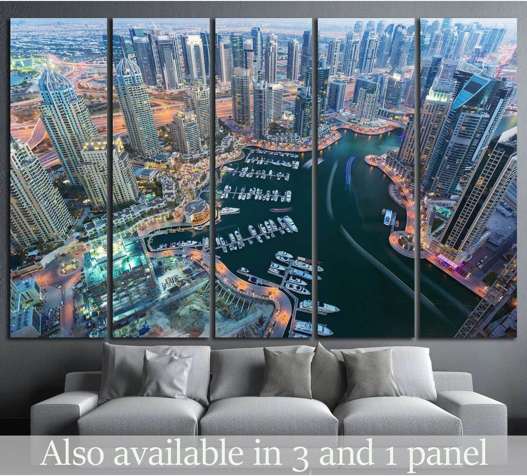 Dubai Marina aerial canvas print with skyscrapers, yachts, and curved waterfront above a sofa in a modern living room