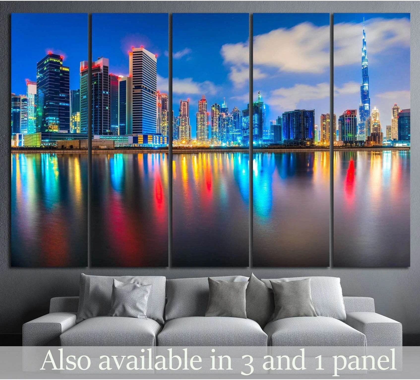 Dubai skyline canvas print with Burj Khalifa and colorful waterfront reflections above a sofa in a modern living room