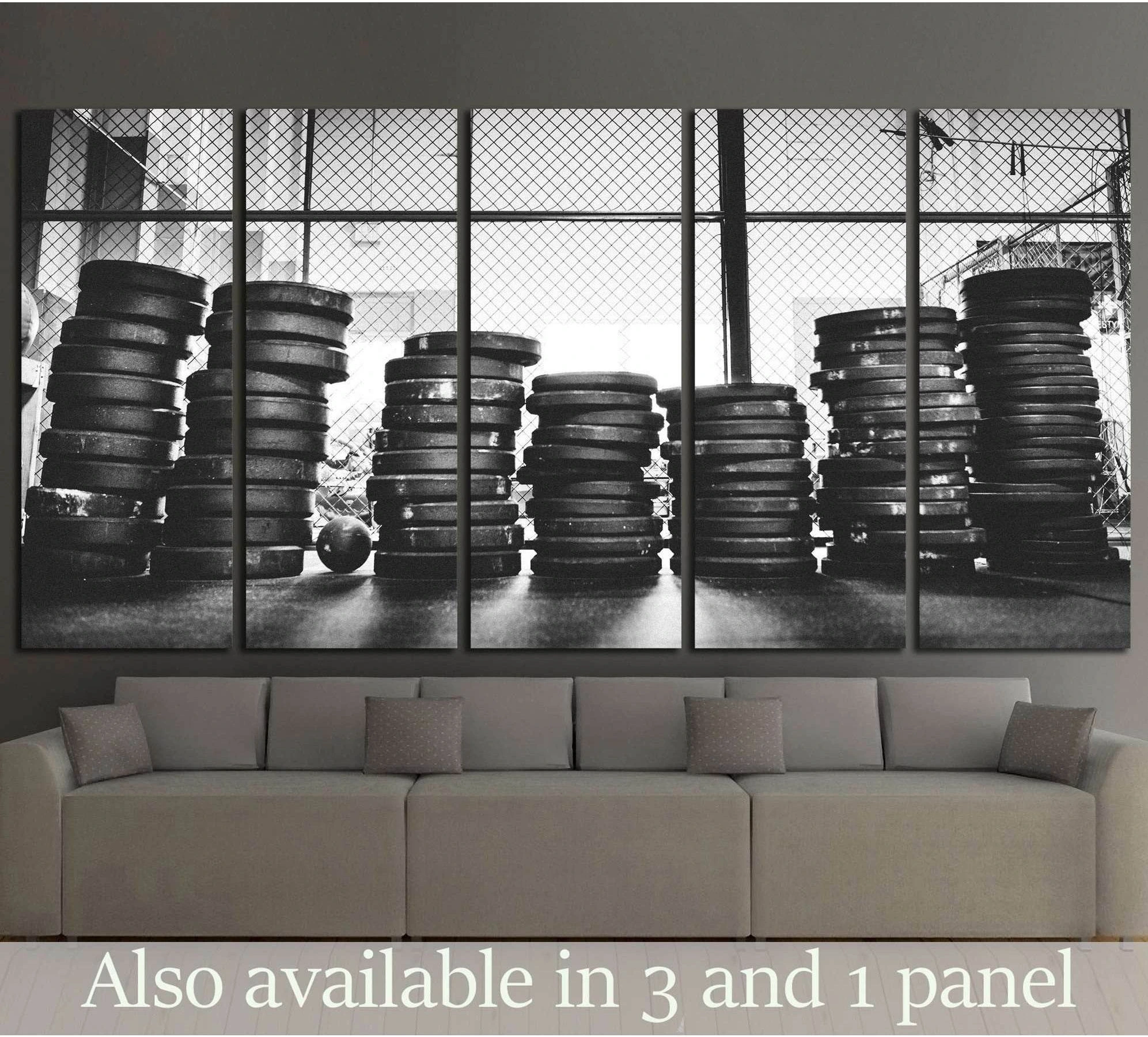 Black and white weight plates canvas print with stacked gym discs in front of industrial windows