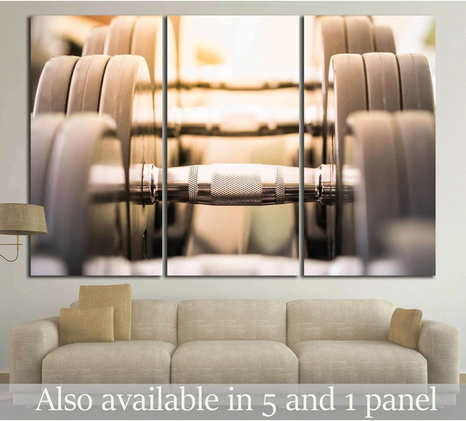 Close-up dumbbells canvas print with chrome handle and warm metallic tones in a modern living room