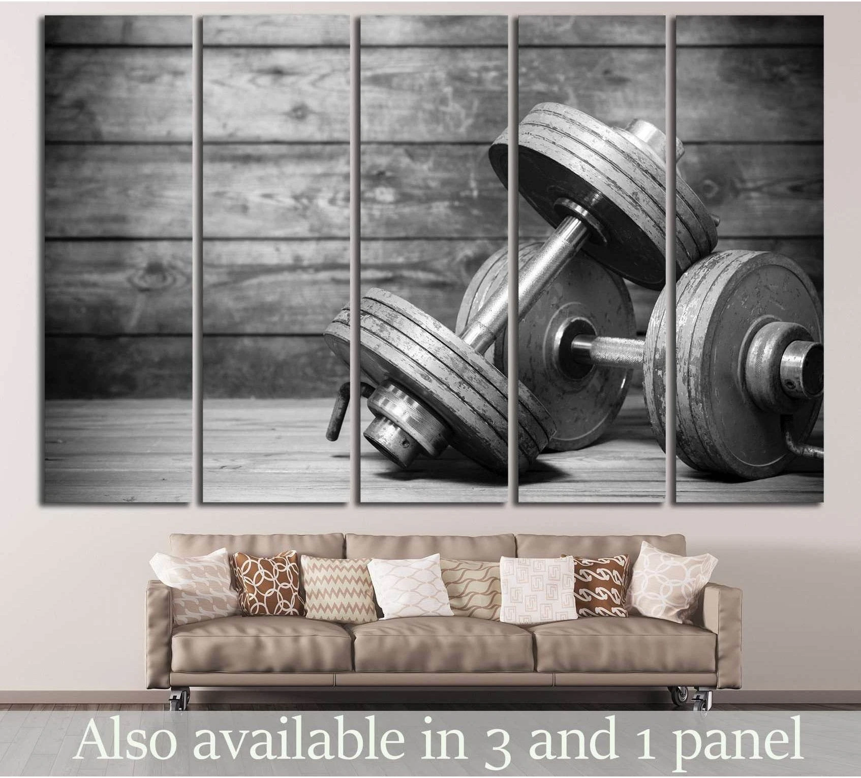 Black and white dumbbells canvas print on rustic wood wall, displayed above a sofa in a modern living room